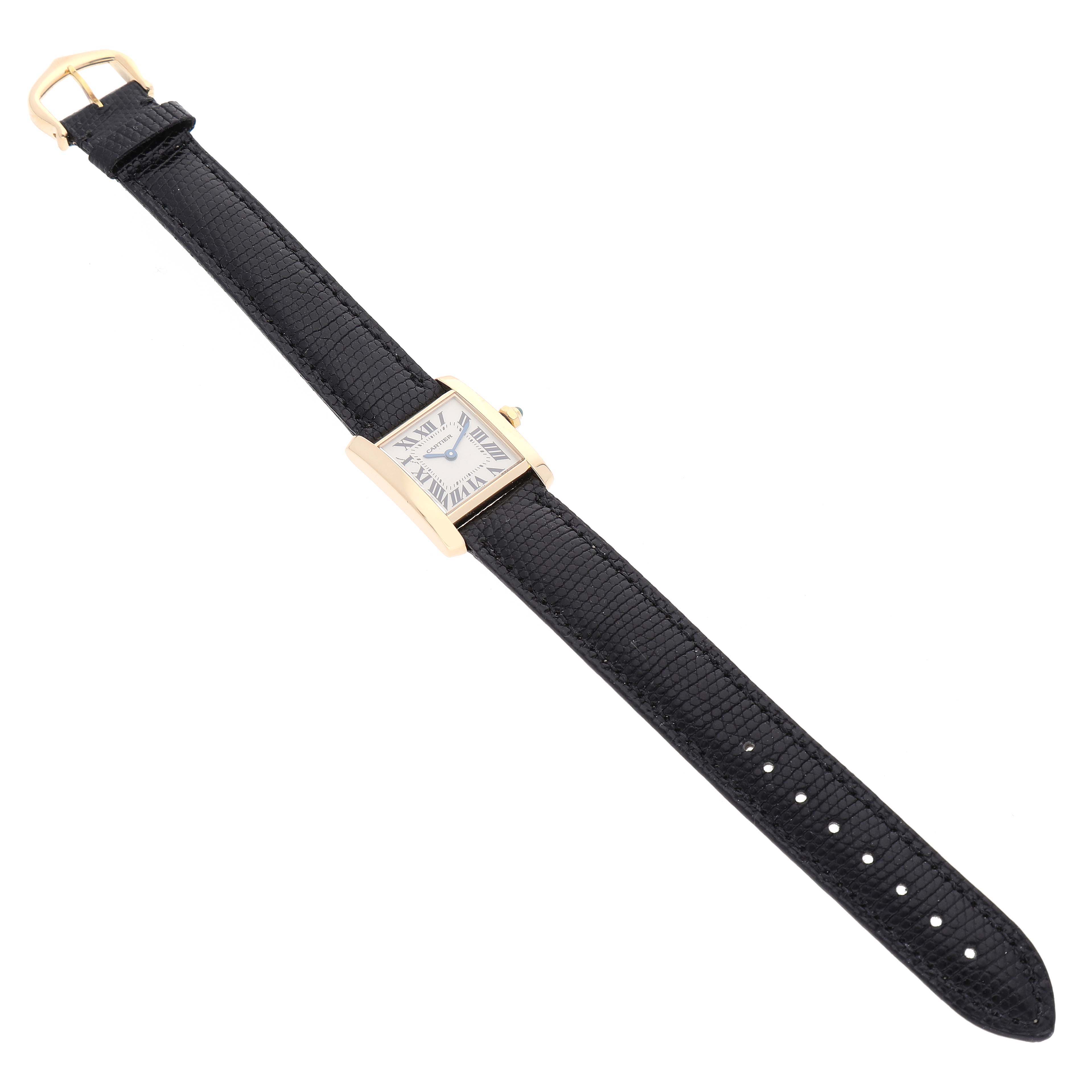 The Cartier Tank Francaise W5000256 Women's Yellow Gold Silver Dial W5000256 Women's Yellow Gold Silver Dial watch is shown from a top-down angle, displaying the full leather strap and rectangular face.