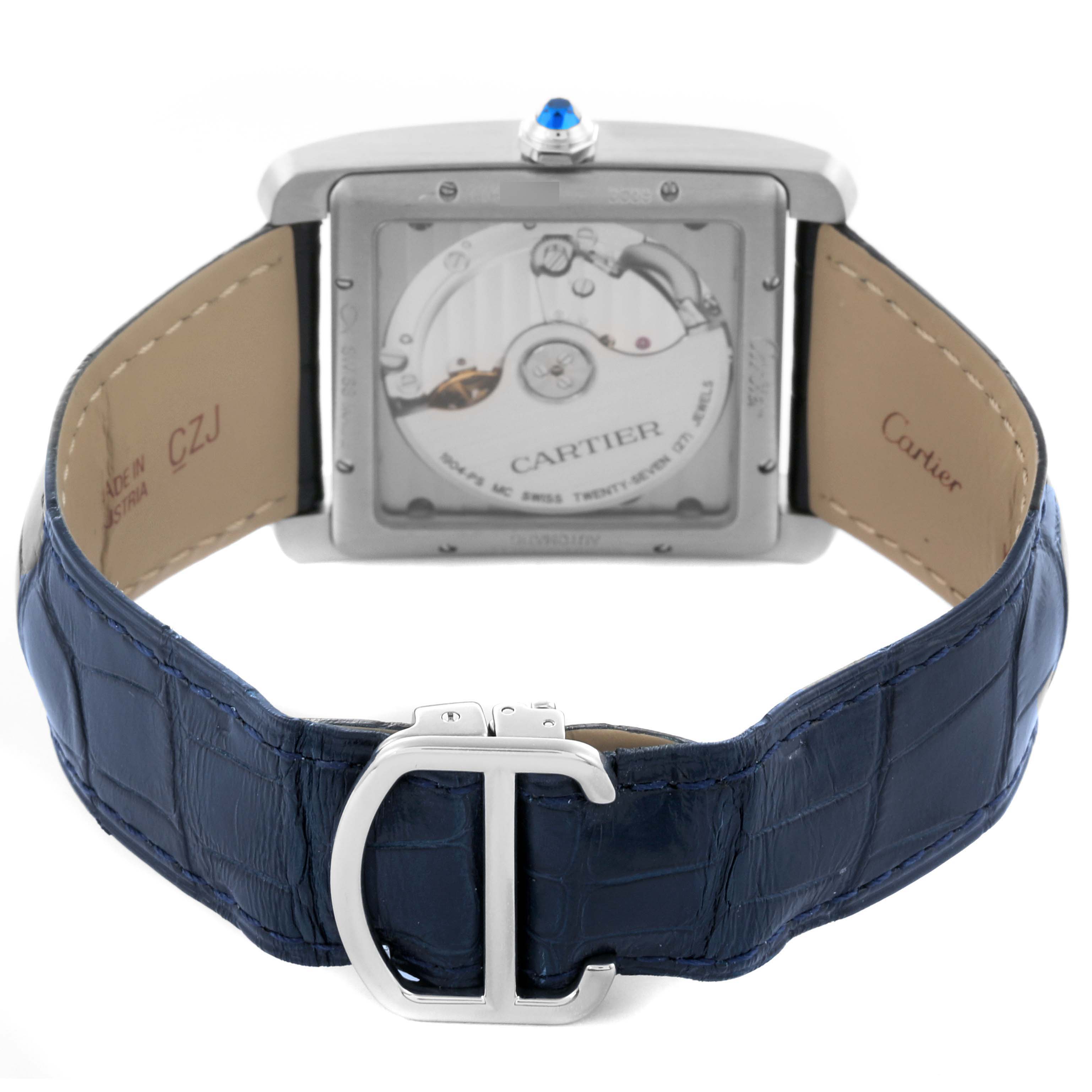 The image shows the Cartier Tank MC WSTA0010 Men's Stainless Steel Blue Dial WSTA0010 Men's Stainless Steel Blue Dial watch from the back, highlighting its movement and blue leather strap with a distinctive clasp.