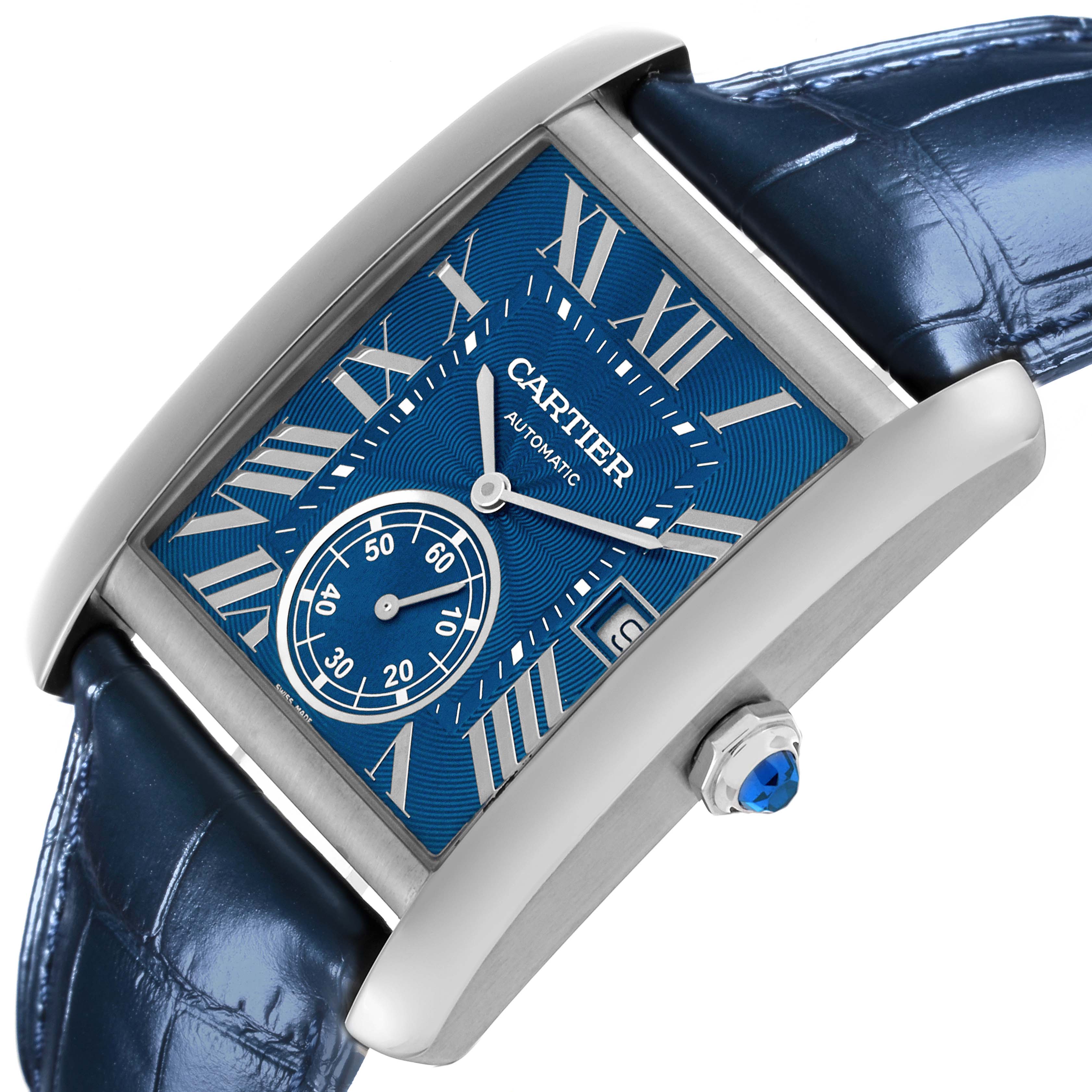 The Cartier Tank MC WSTA0010 Men's Stainless Steel Blue Dial WSTA0010 Men's Stainless Steel Blue Dial watch is shown at an angle highlighting the blue dial, Roman numerals, subdial, crown, and blue leather strap.
