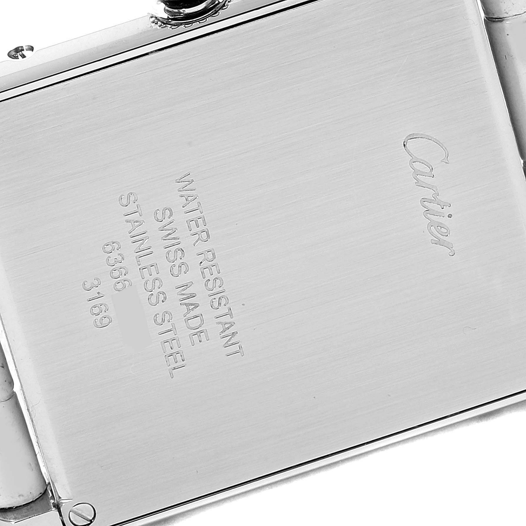The image shows the back case of a Cartier Tank Solo W1018355 Men
s Stainless Steel Silver Dial W1018355 Men
s Stainless Steel Silver Dial watch, highlighting the brand
s engraving and specifications.
