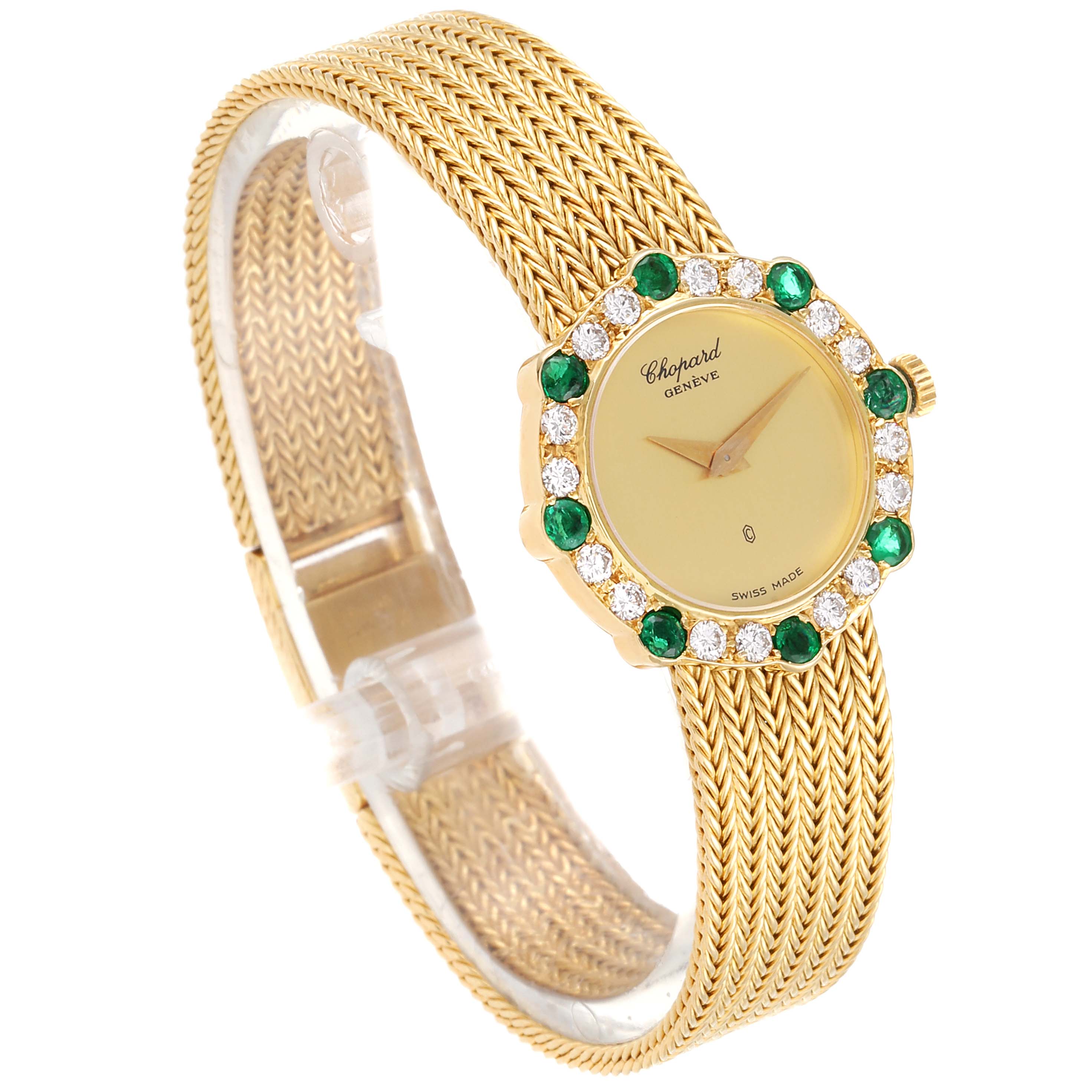 This image shows a Chopard 4057 Women's Yellow Gold Champagne Dial 4057 Women's Yellow Gold Champagne Dial 4057 model watch at an angle, highlighting its gold mesh band and diamond-emerald studded face.