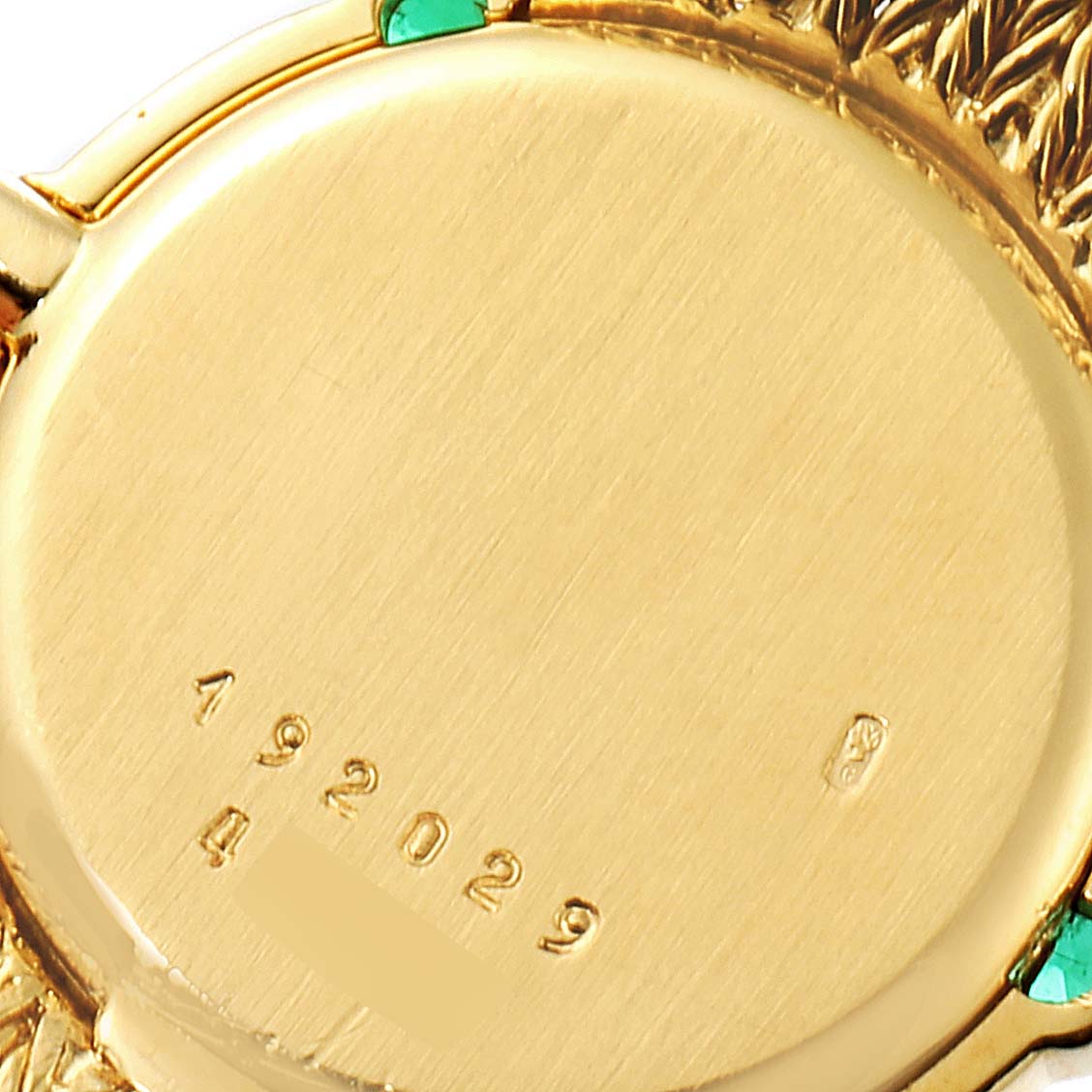 This image shows a close-up of the back case of the Chopard 4057 Women's Yellow Gold Champagne Dial 4057 Women's Yellow Gold Champagne Dial 4057 model 18K Yellow Gold Diamond Emerald Vintage Cocktail Ladies Watch.