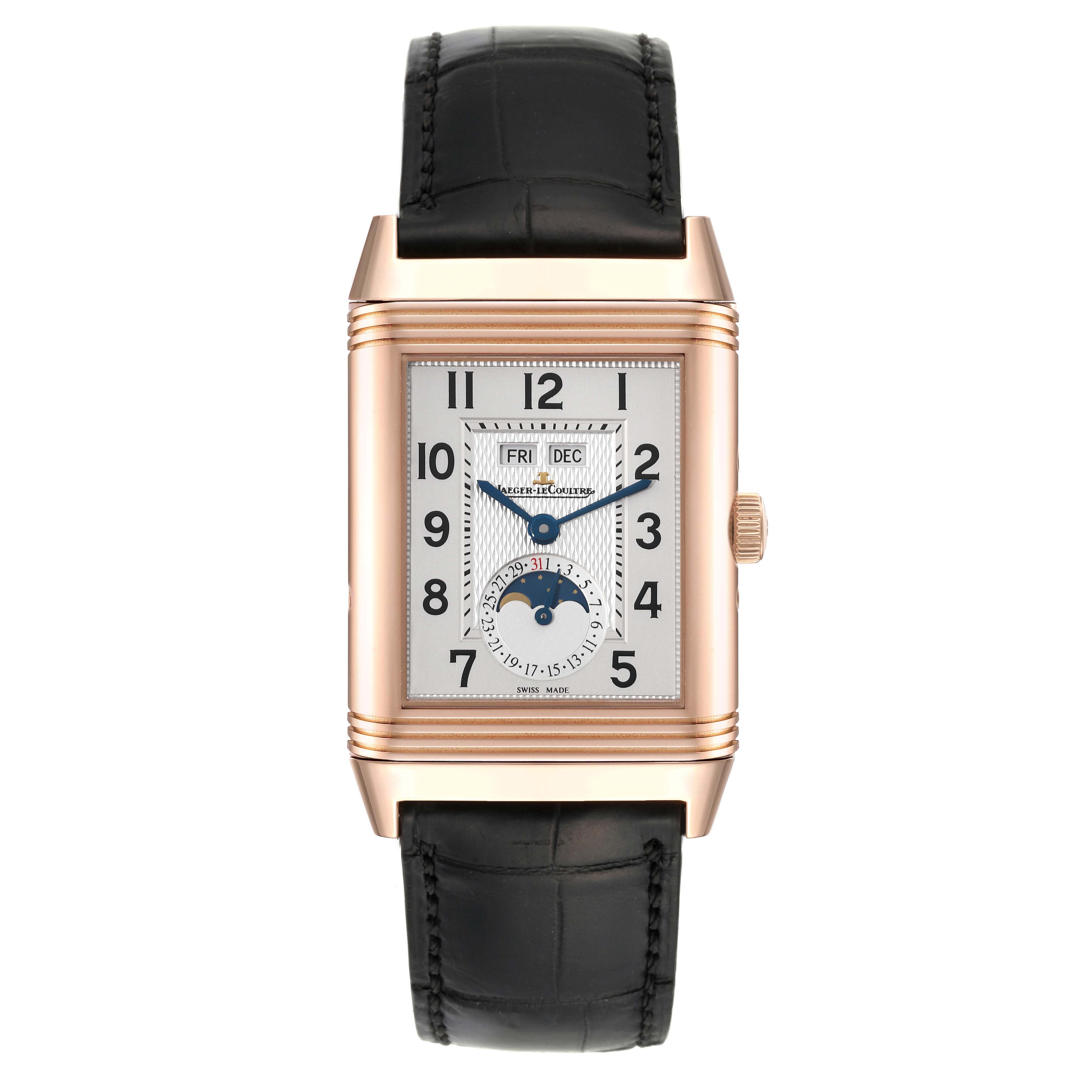 The image shows a front view of a Jaeger-LeCoultre Reverso watch with a rectangular case, black leather strap, and detailed dial features.
