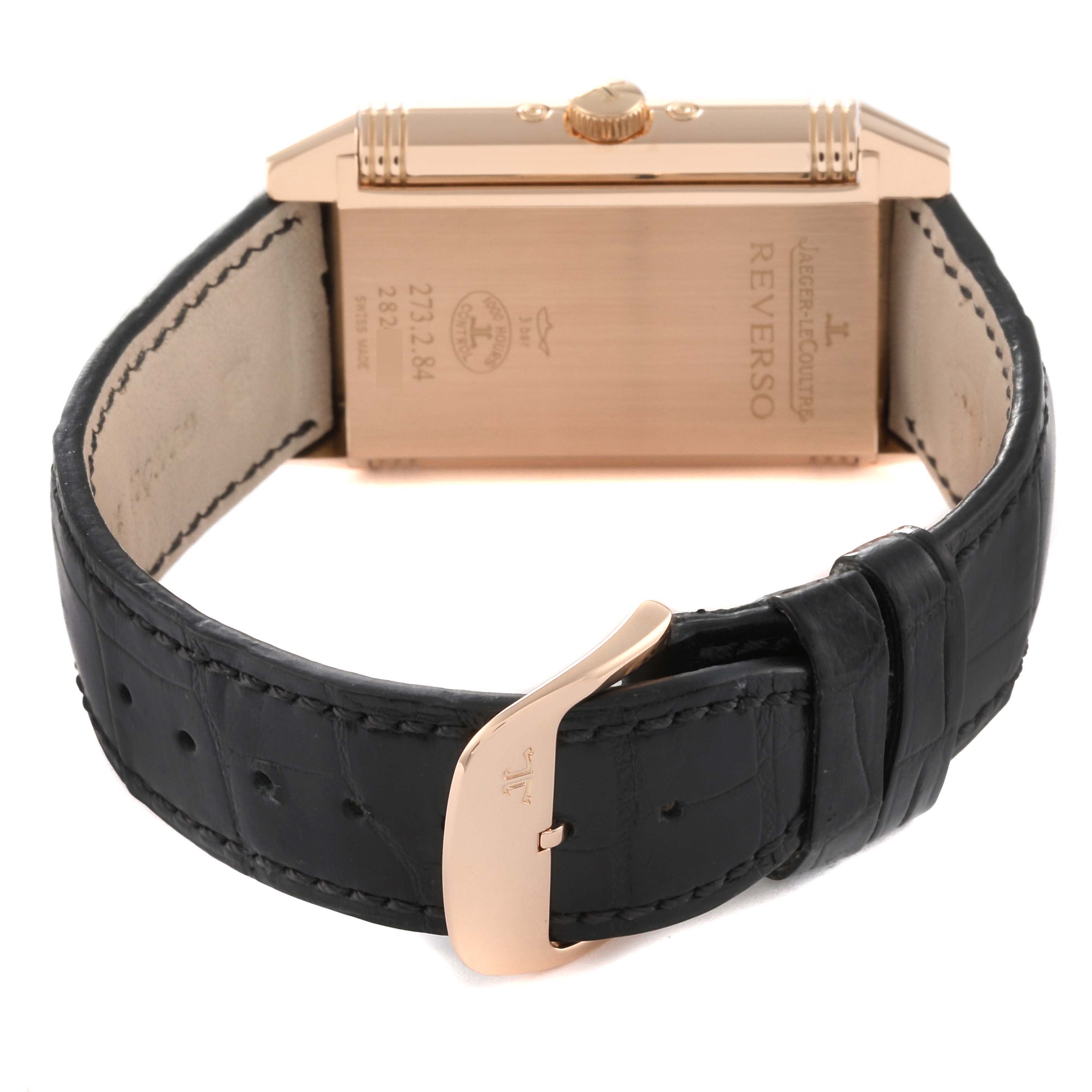 This image shows the back view of a Jaeger-LeCoultre Reverso watch and its clasp, emphasizing the watch case and strap.