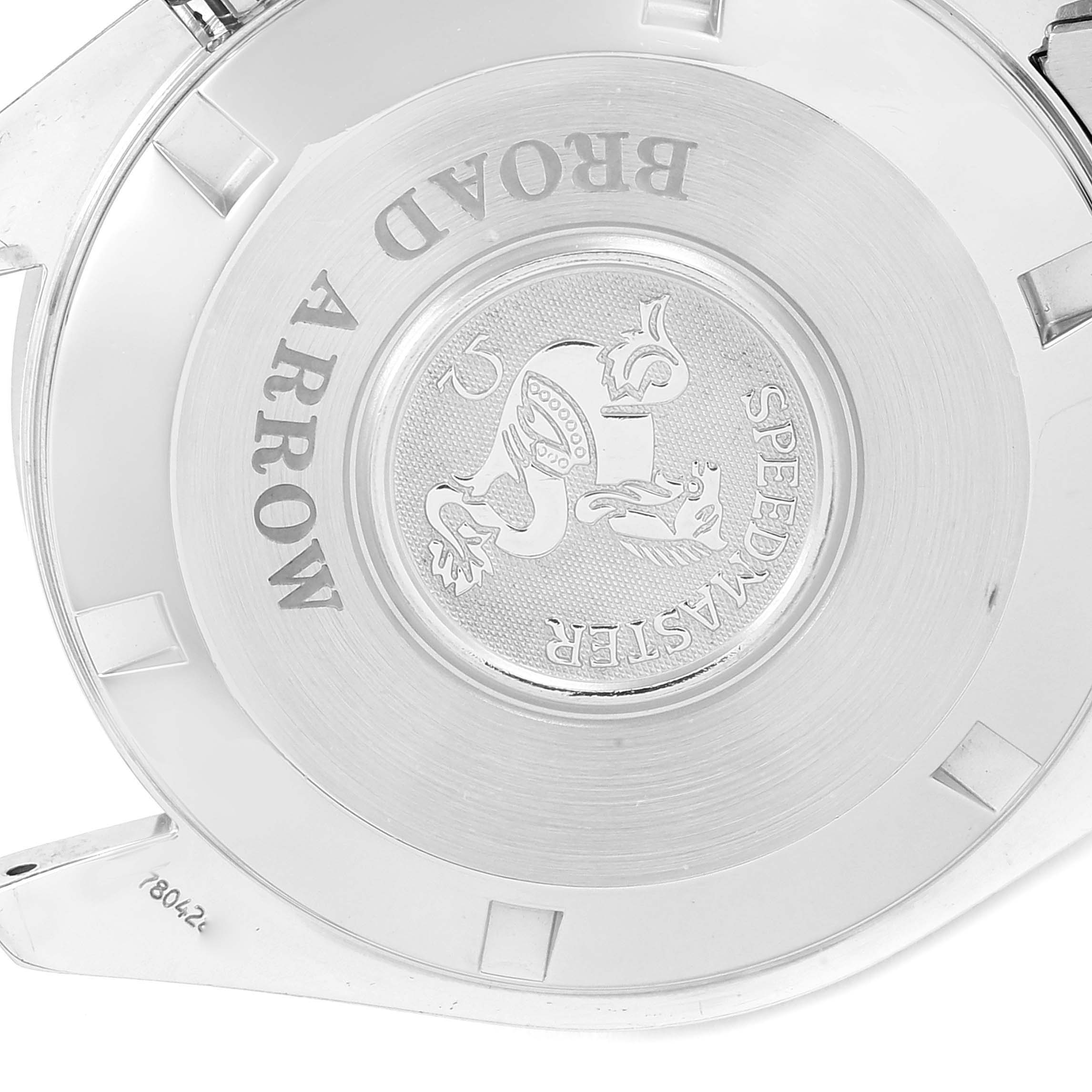 The image shows the case back of an Omega Speedmaster 3551.20.00 Men's Stainless Steel White Dial 3551.20.00 Men's Stainless Steel White Dial Broad Arrow watch, highlighting its engraved logo and inscriptions.