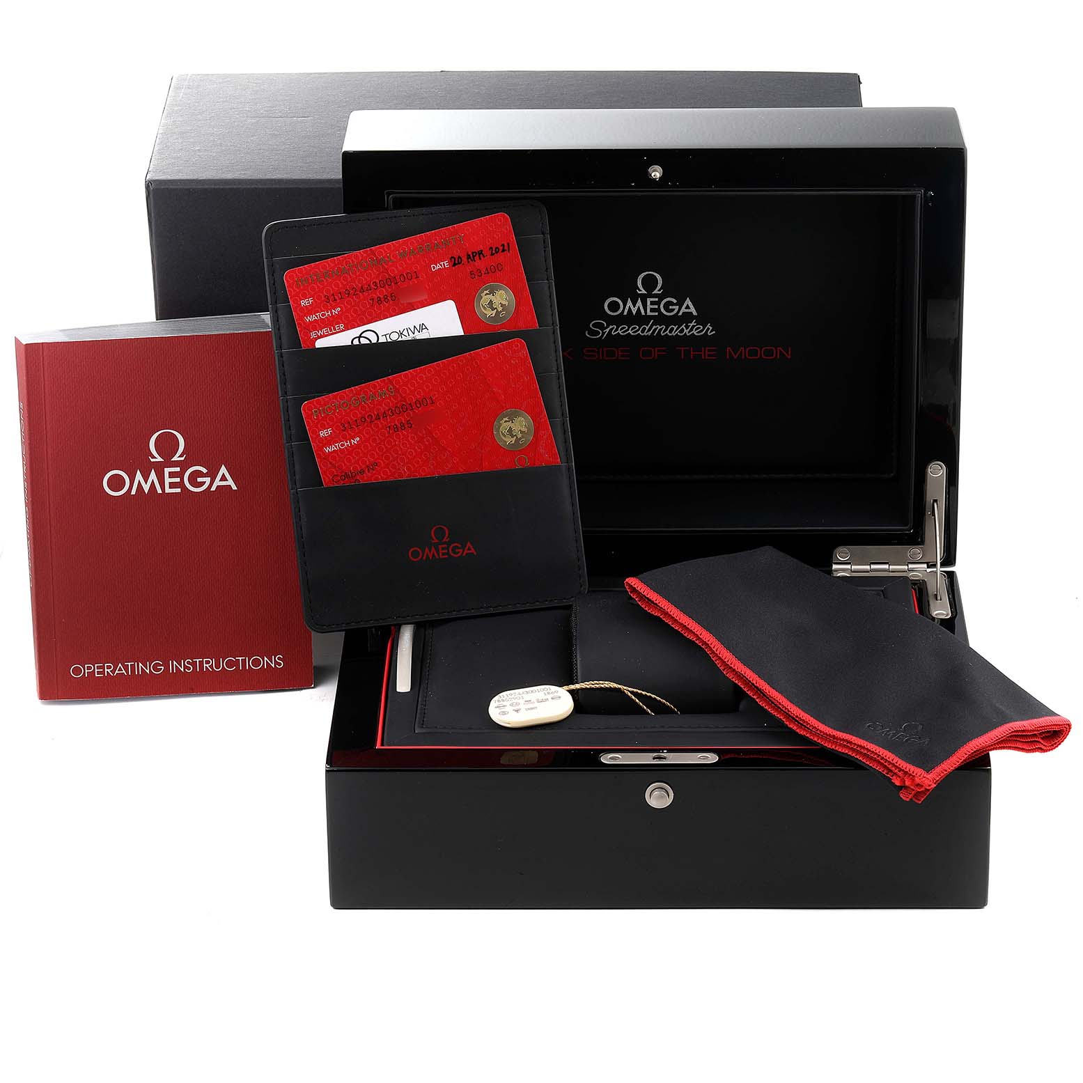 The image shows the Omega Speedmaster 311.92.44.30.01.001 Men's Ceramic Black Dial 311.92.44.30.01.001 Men's Ceramic Black Dial accessories, including the box, instruction manual, warranty cards, and cleaning cloth, viewed from the front.