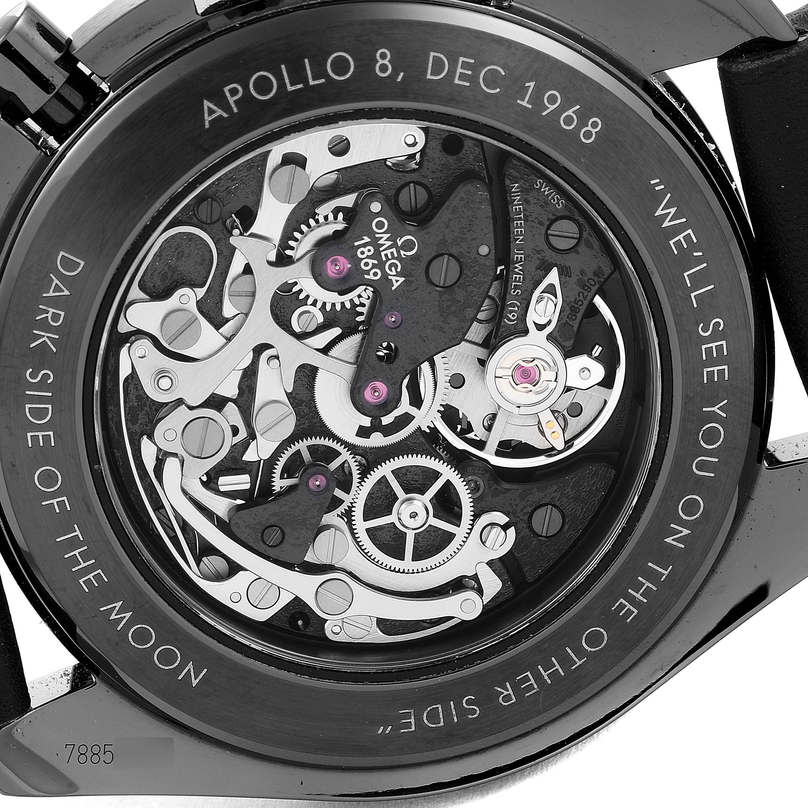 The image shows the back of the Omega Speedmaster 311.92.44.30.01.001 Men's Ceramic Black Dial 311.92.44.30.01.001 Men's Ceramic Black Dial watch, highlighting its intricate internal mechanics and engravings.