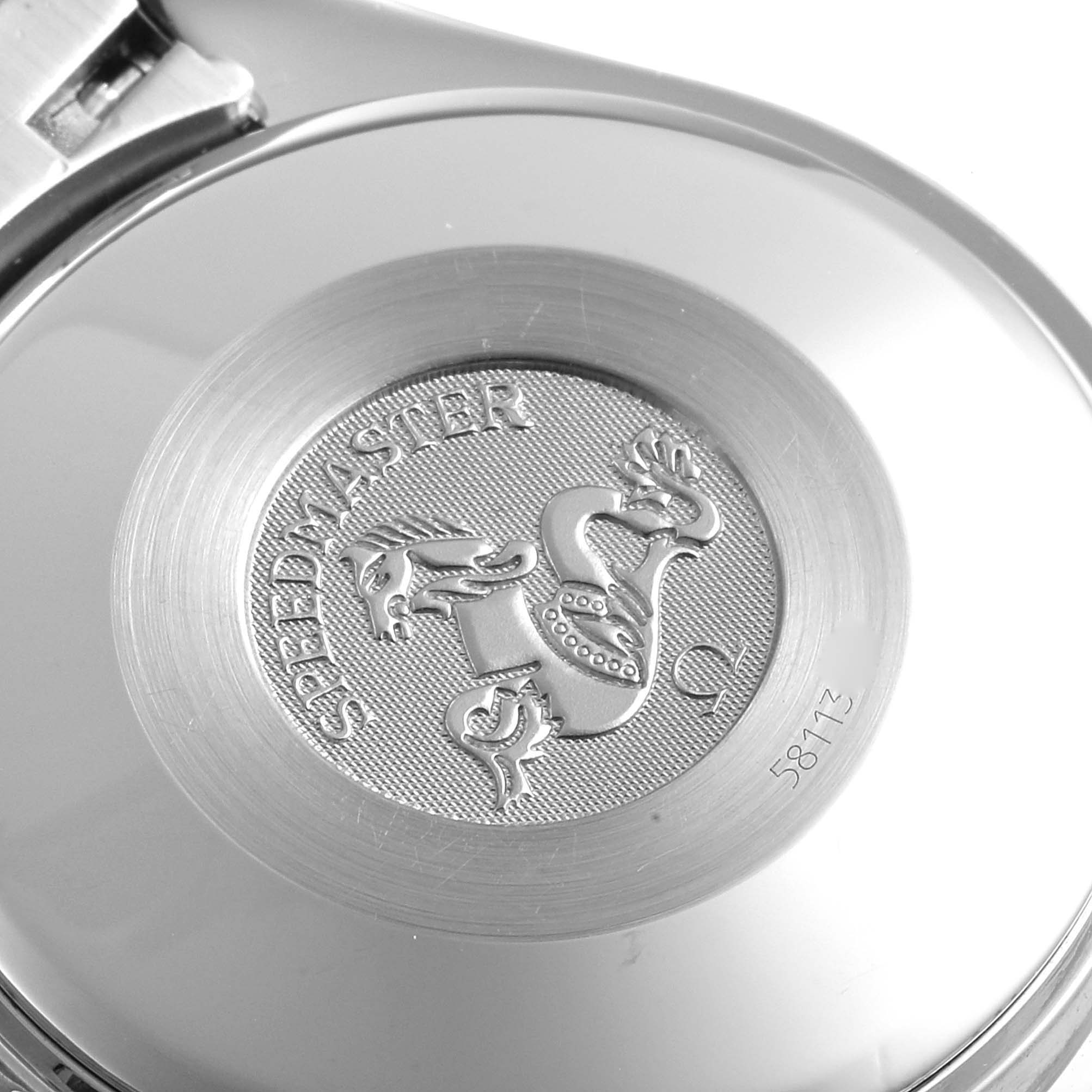 This image shows the back case of an Omega Speedmaster 3513.52.00 Men's Stainless Steel Black Dial 3513.52.00 Men's Stainless Steel Black Dial watch, featuring the engraved emblem and model-specific details.