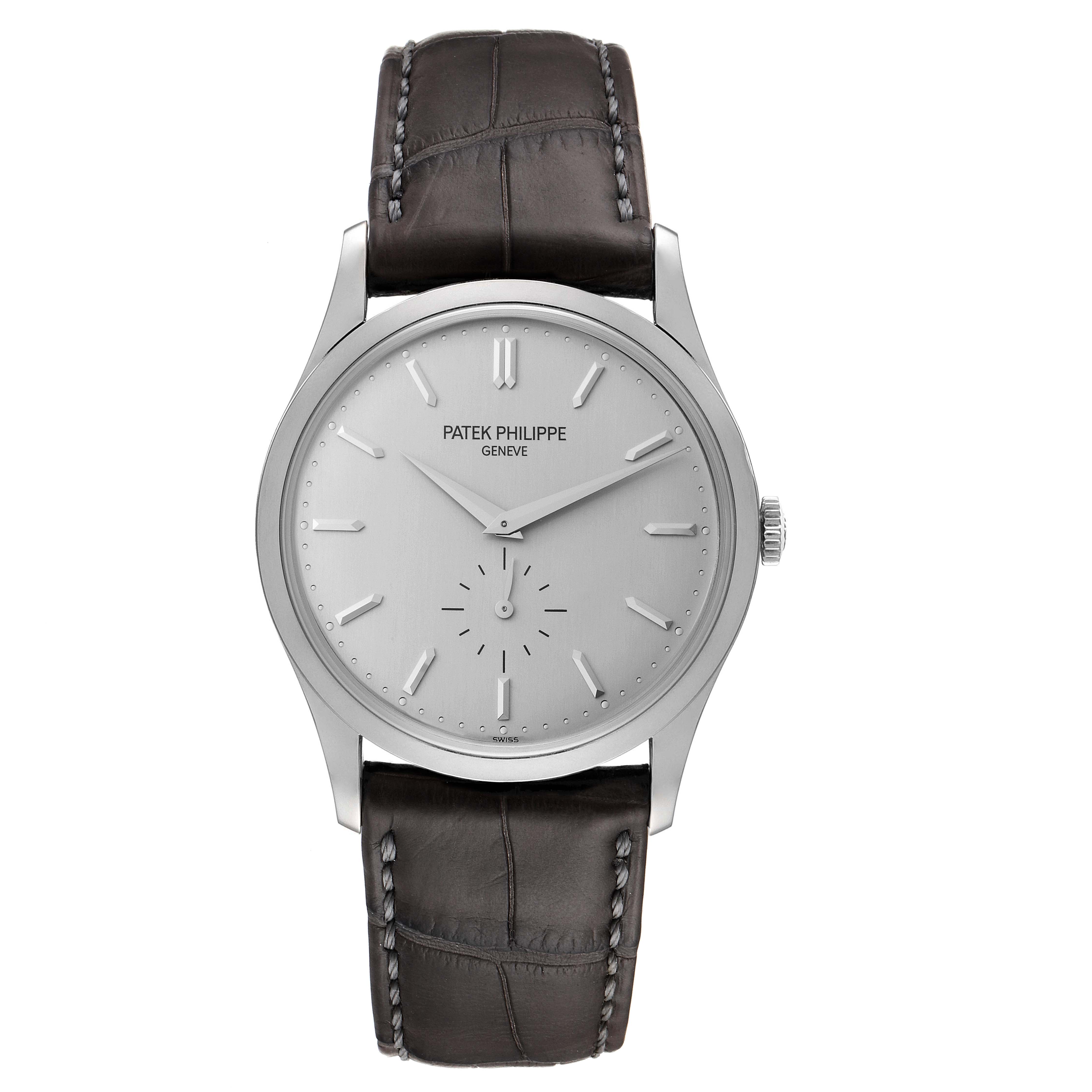 The image shows a front view of the Patek Philippe Calatrava 5196G Men's White Gold Silver Dial 5196G Men's White Gold Silver Dial watch, displaying its face, hands, crown, and leather strap.