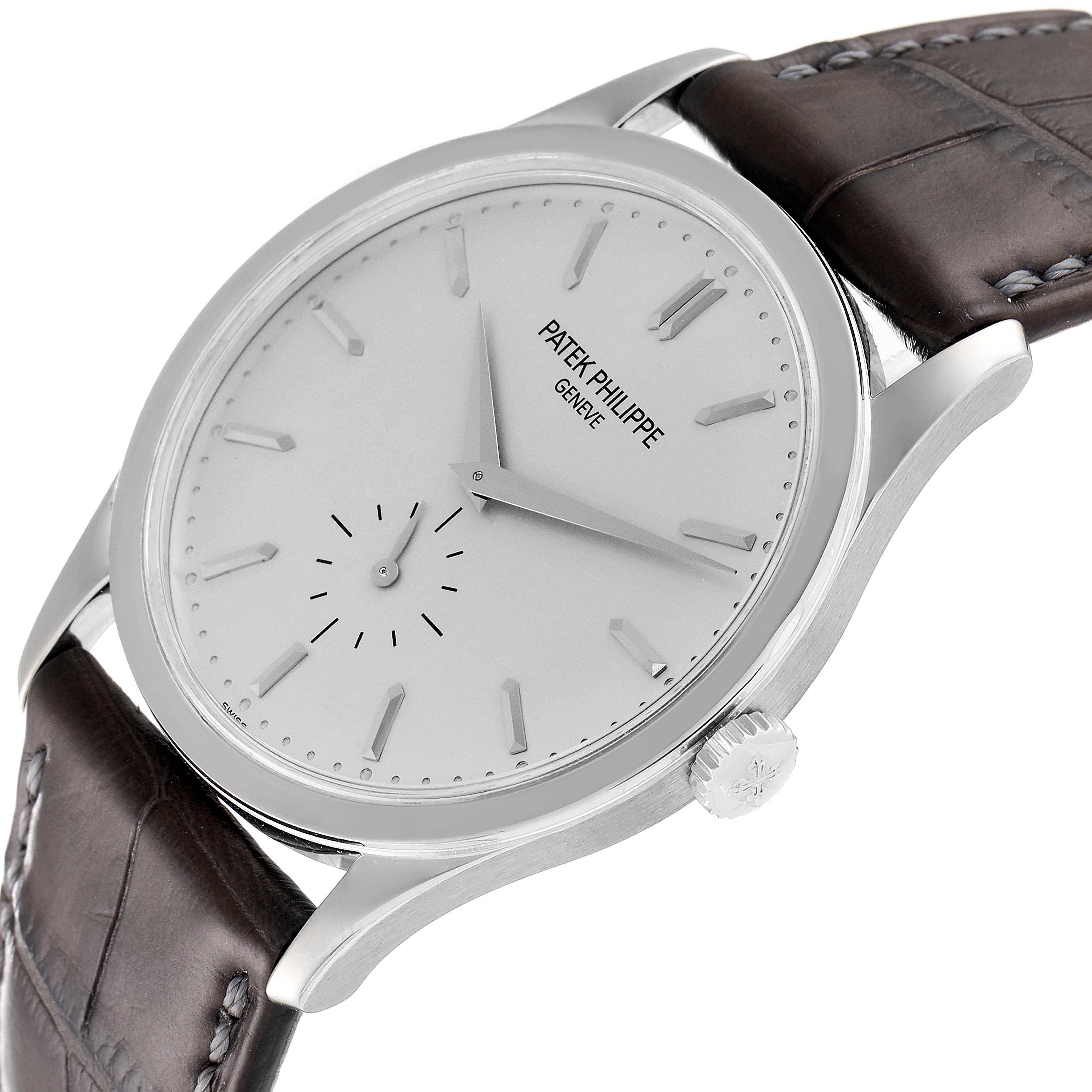 The image shows a side view angle of the Patek Philippe Calatrava 5196G Men's White Gold Silver Dial 5196G Men's White Gold Silver Dial model, displaying the watch face, crown, and leather strap.