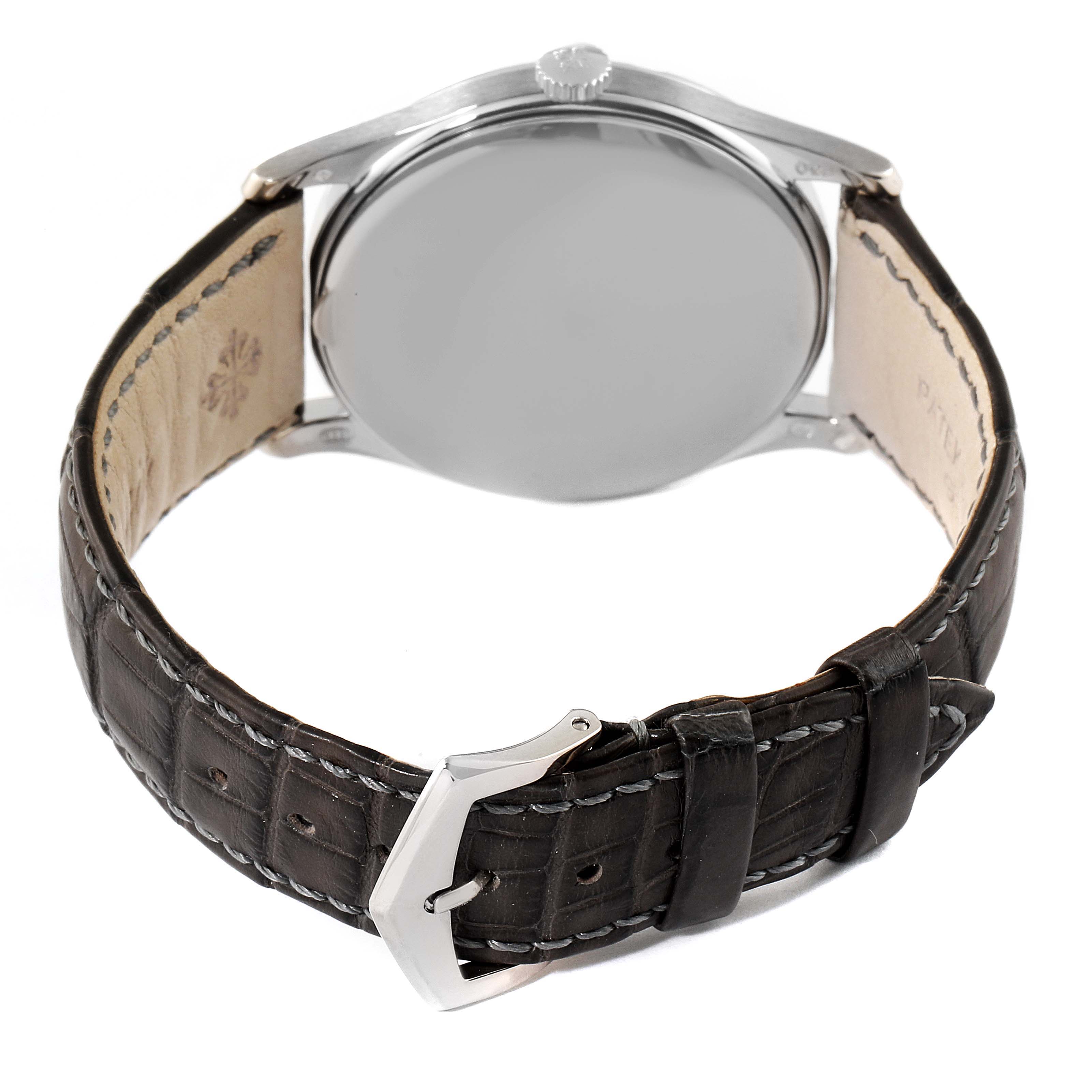 The image shows the back view of a Patek Philippe Calatrava 5196G Men's White Gold Silver Dial 5196G Men's White Gold Silver Dial watch with a leather strap and metal buckle.