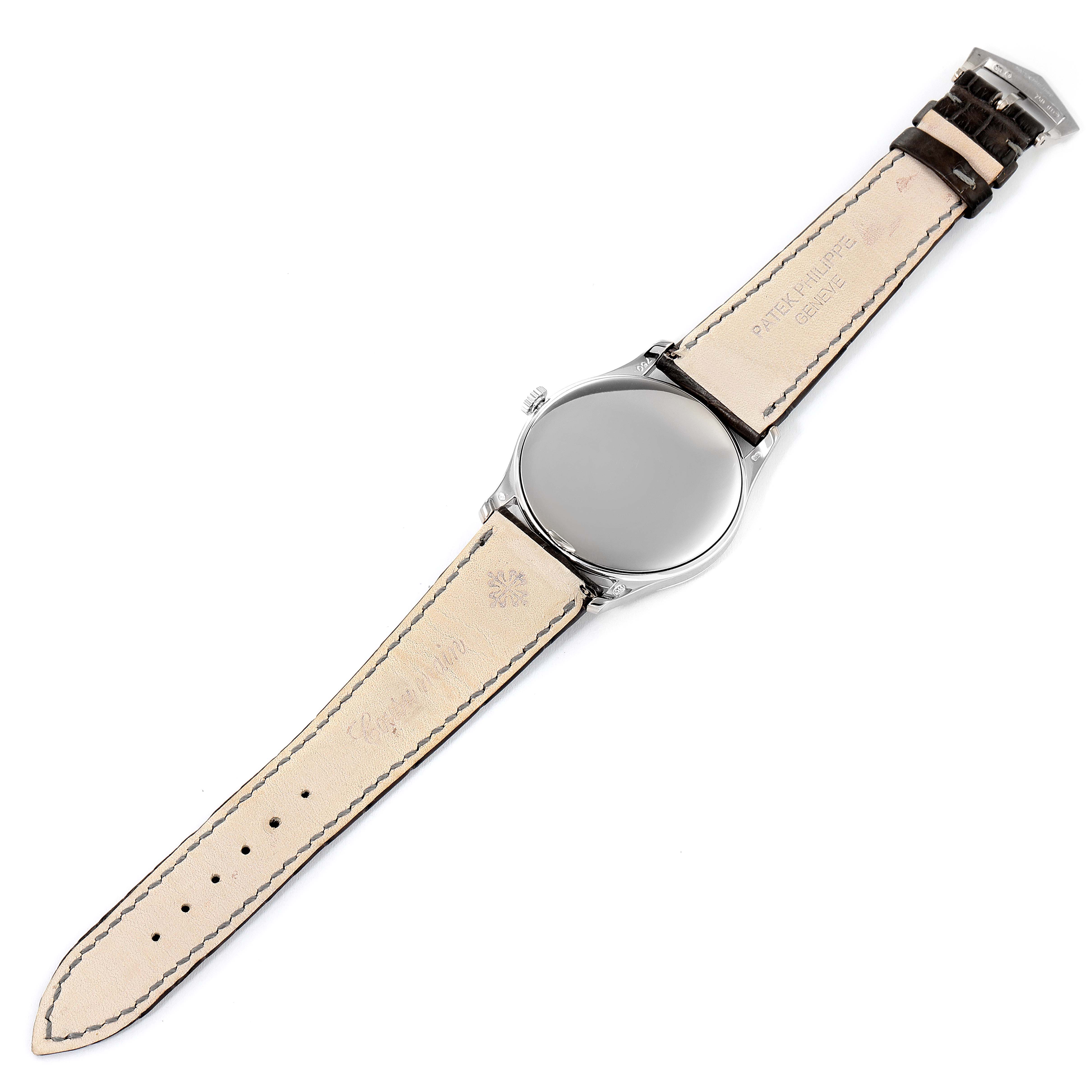 The image shows the back side of a Patek Philippe Calatrava 5196G Men's White Gold Silver Dial 5196G Men's White Gold Silver Dial watch, including the leather strap and buckle.