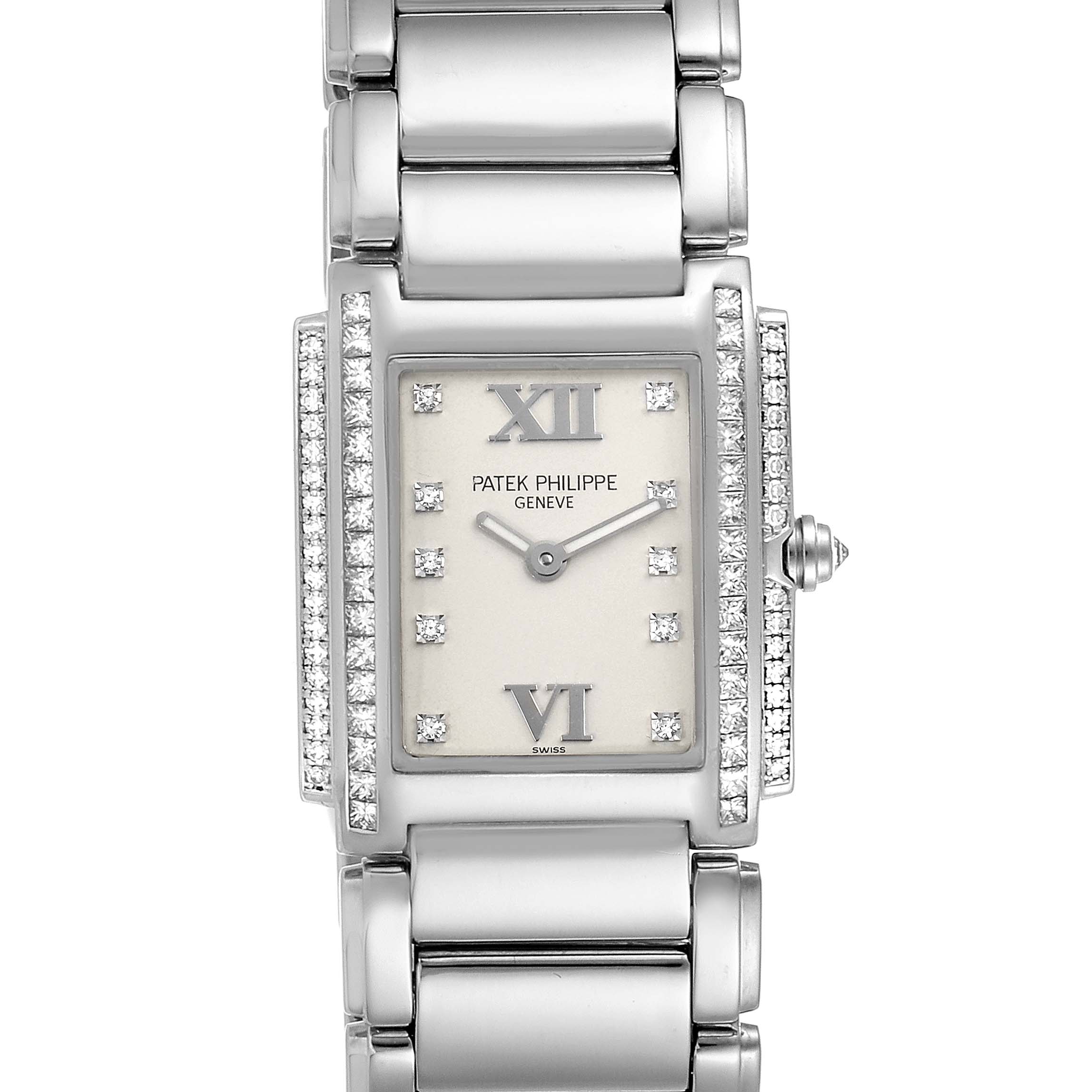 The image shows a frontal view of a Patek Philippe Twenty-4 4908/310G-011 Women's White Gold Silver Dial 4908/310G-011 Women's White Gold Silver Dial model watch, highlighting the face, bracelet, and diamond accents.