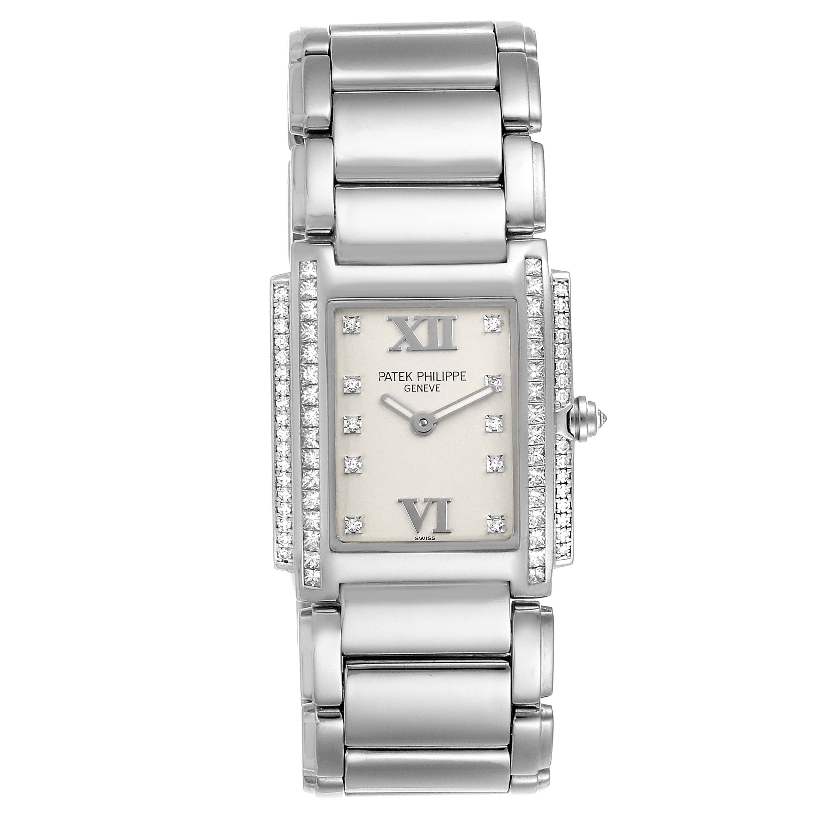 The image shows a front view of the Patek Philippe Twenty-4 4908/310G-011 Women's White Gold Silver Dial 4908/310G-011 Women's White Gold Silver Dial model, highlighting the face, dial, and bracelet with diamonds.