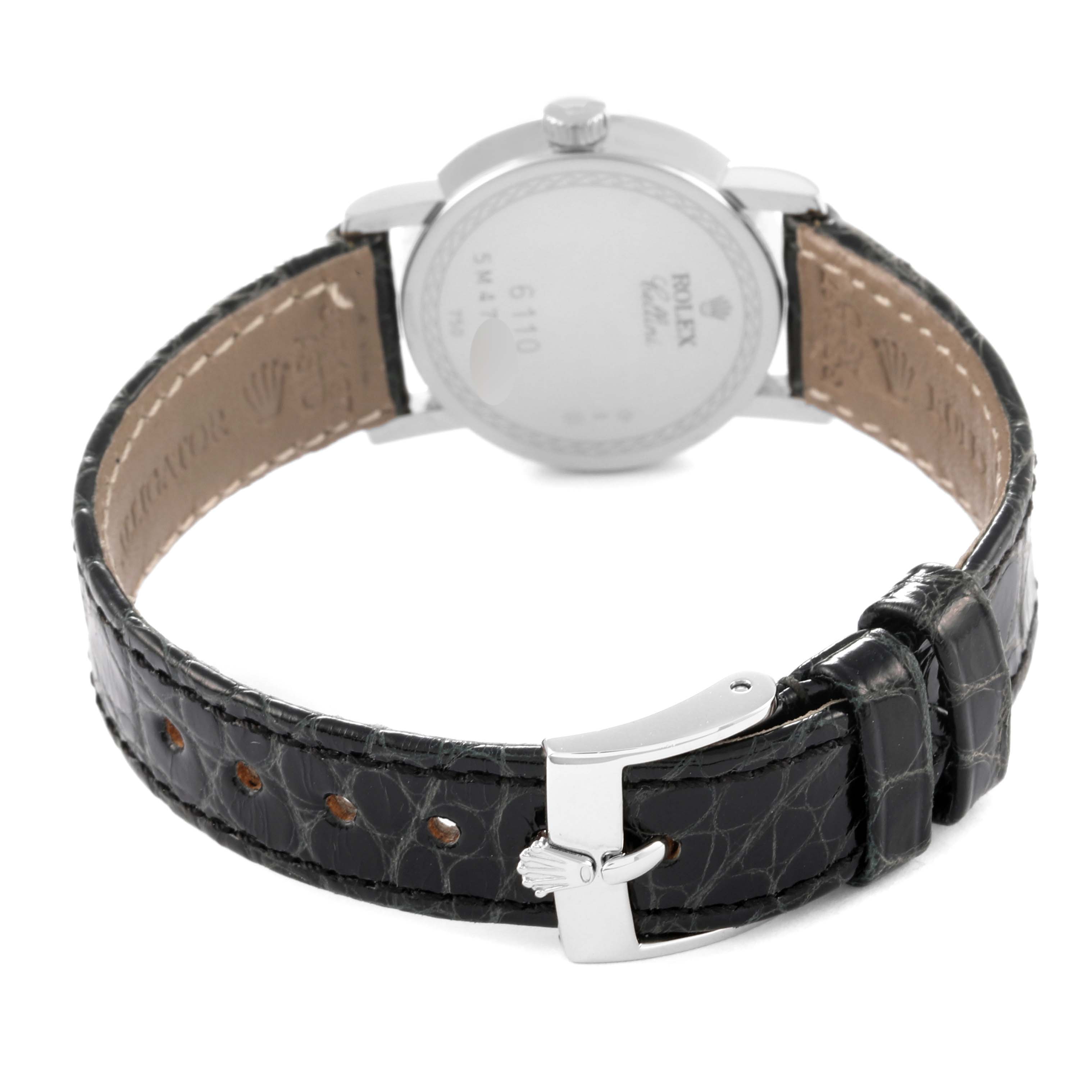 This image shows the back view of a Rolex Cellini 6110/9 Women's White Gold White Dial 6110/9 Women's White Gold White Dial watch, including the case back and leather strap with a buckle.
