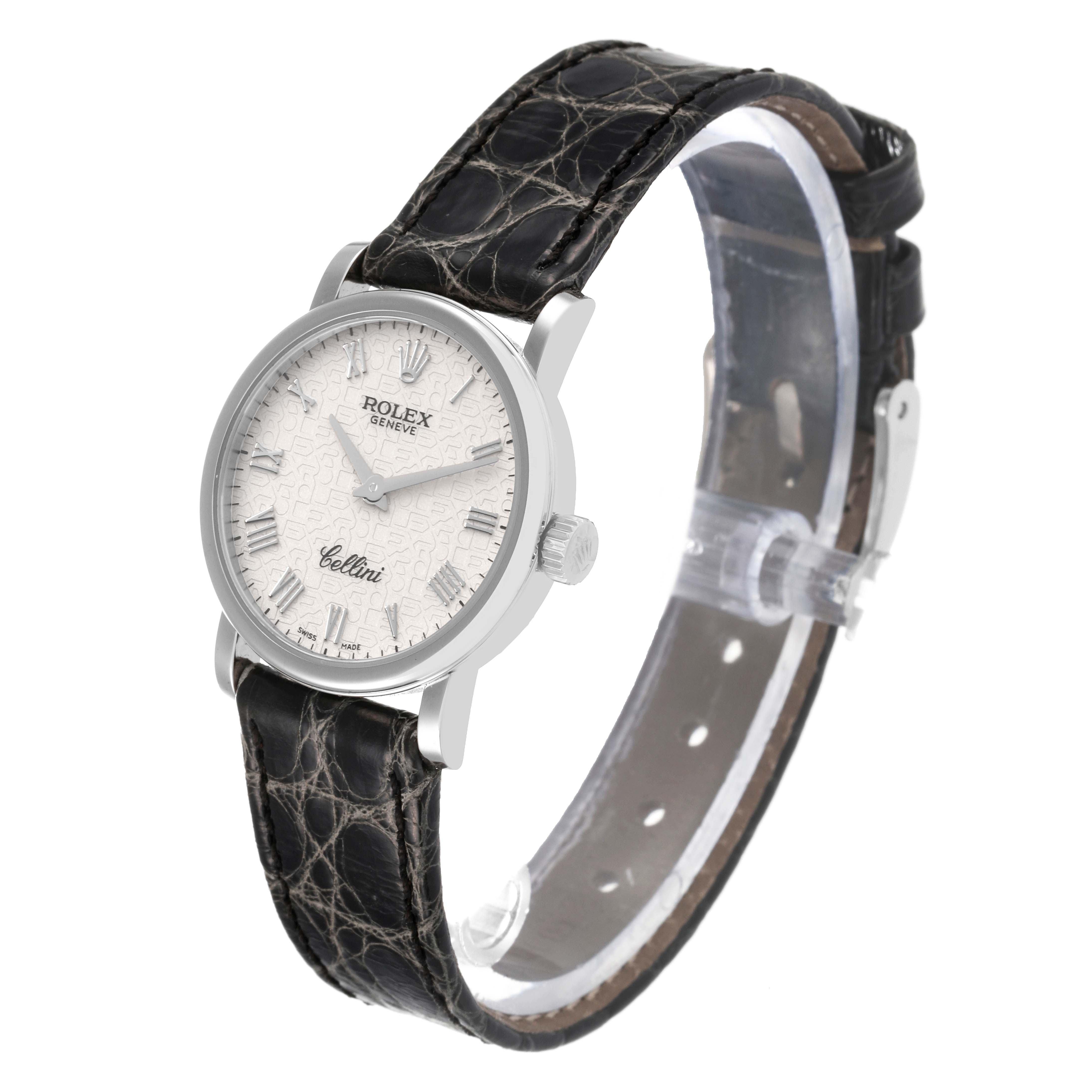 The image shows a side angle of a Rolex Cellini 6110/9 Women's White Gold White Dial 6110/9 Women's White Gold White Dial watch featuring its dial, bezel, crown, and leather strap.