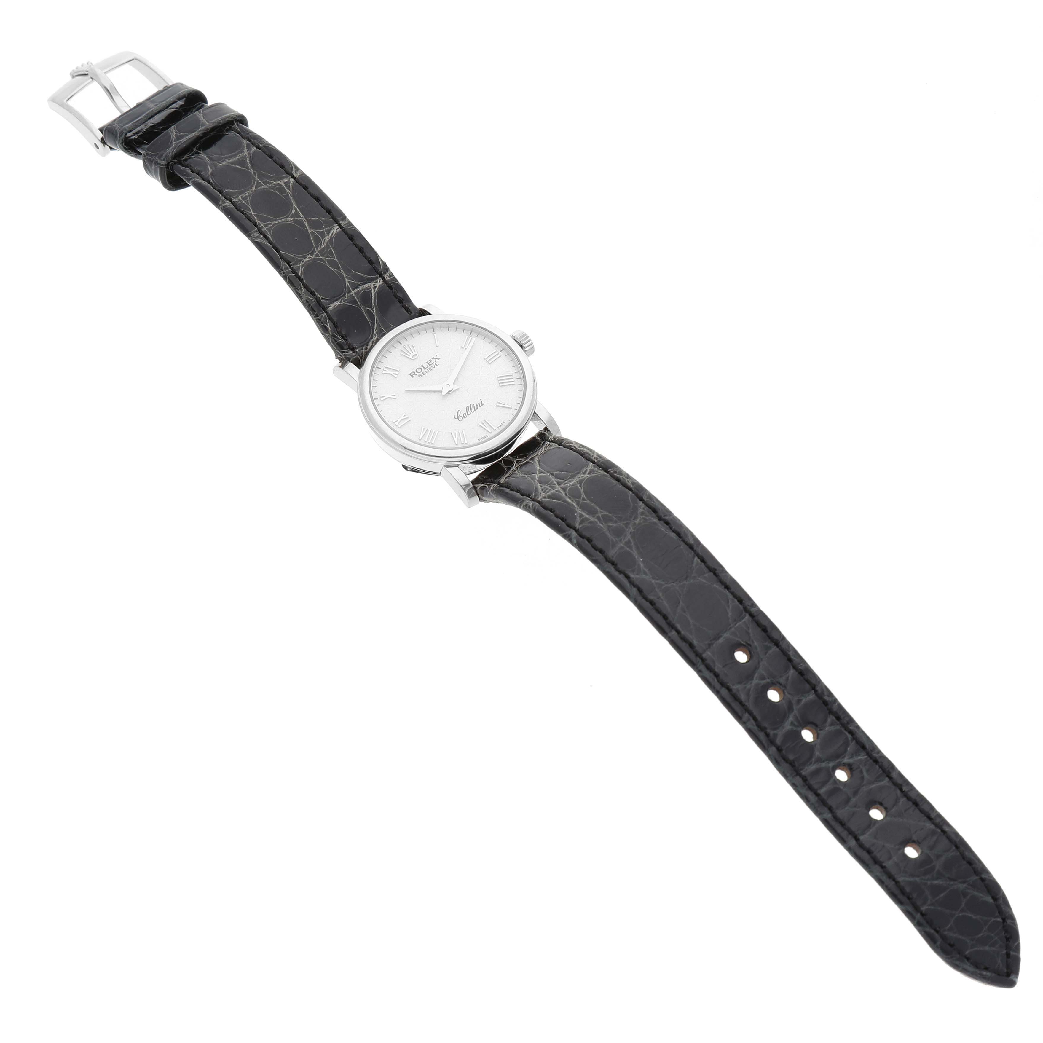 This image shows a top-down view of a Rolex Cellini 6110/9 Women's White Gold White Dial 6110/9 Women's White Gold White Dial watch, displaying the face, case, and leather strap.