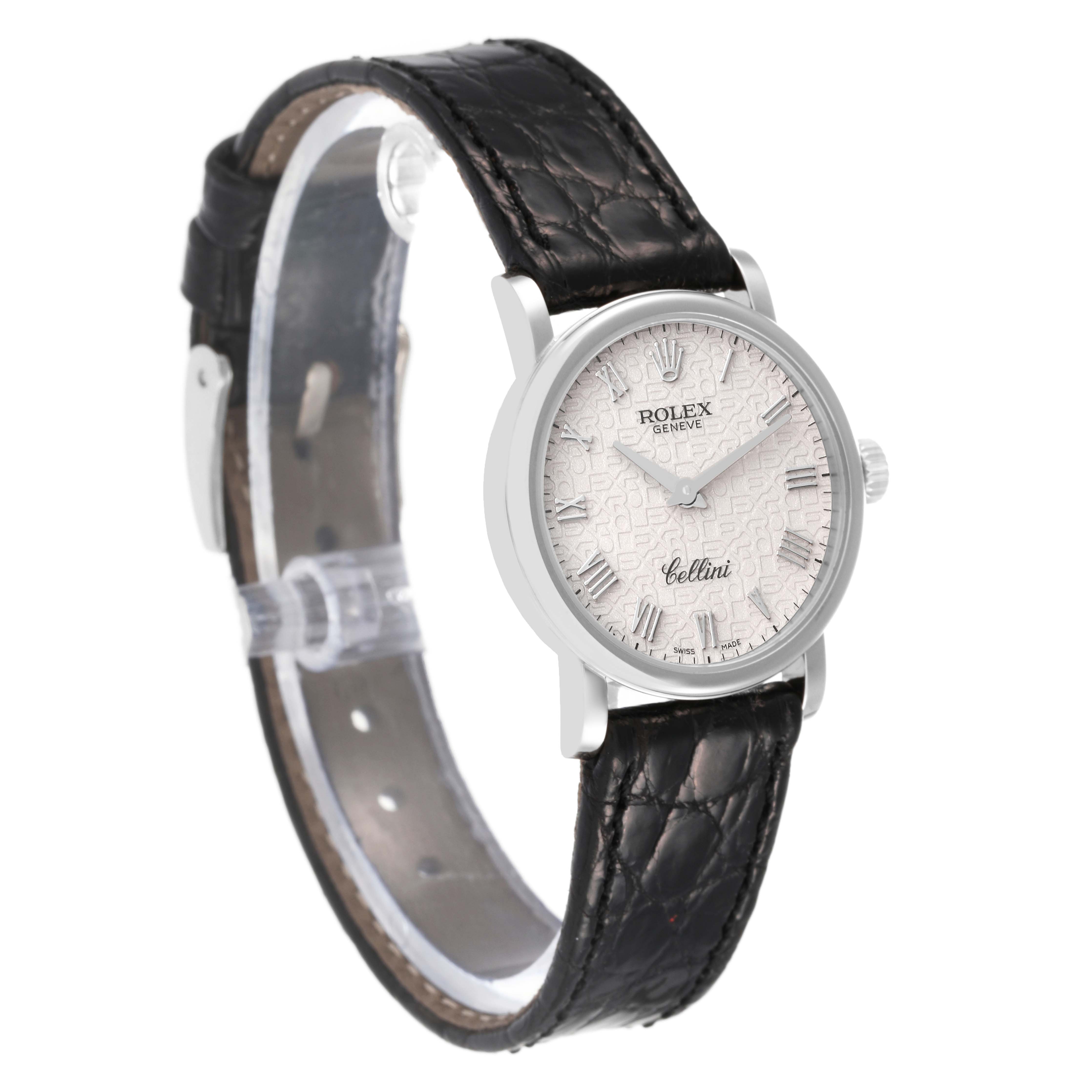 The Rolex Cellini 6110/9 Women's White Gold White Dial 6110/9 Women's White Gold White Dial watch is shown at an angled side view, displaying its face, black leather strap, and buckle.