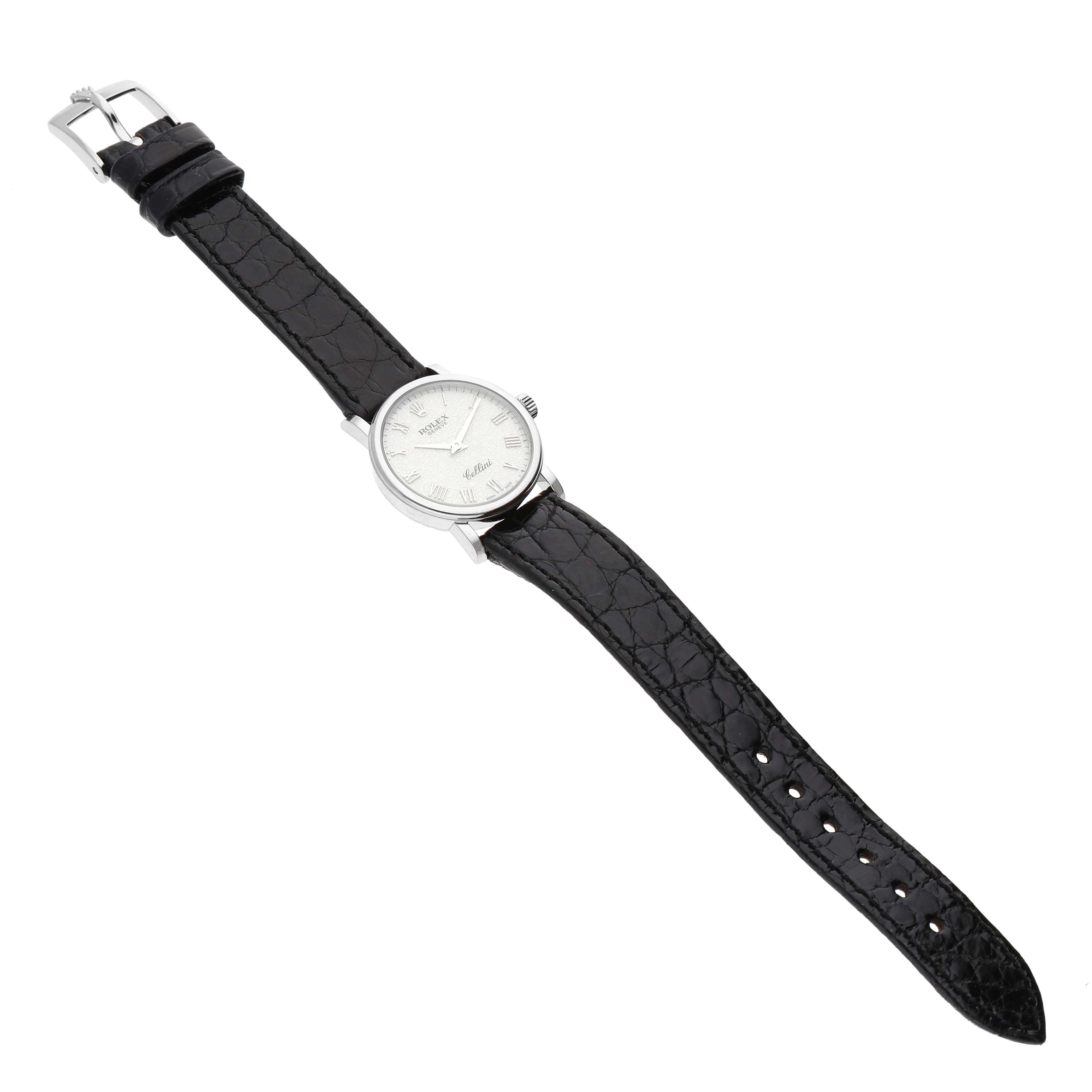 The image shows a full view of a Rolex Cellini 6110/9 Women's White Gold White Dial 6110/9 Women's White Gold White Dial watch at a slight angle, featuring the dial, case, crown, and leather strap.