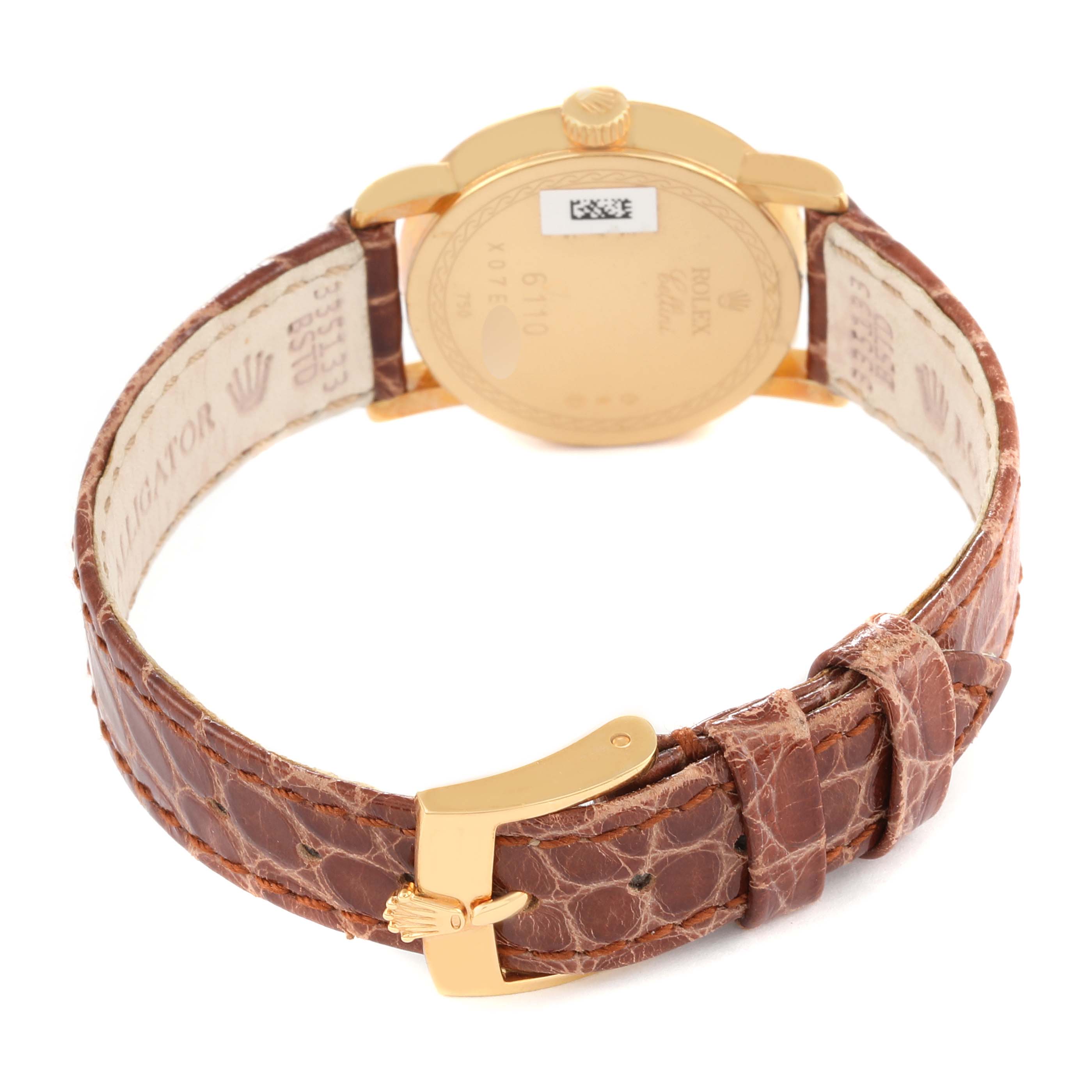 The image shows the back view of a Rolex Cellini 6110/8 Women's Yellow Gold Mother of Pearl Dial 6110/8 Women's Yellow Gold Mother of Pearl Dial watch, highlighting its case back and brown leather strap with a gold clasp.