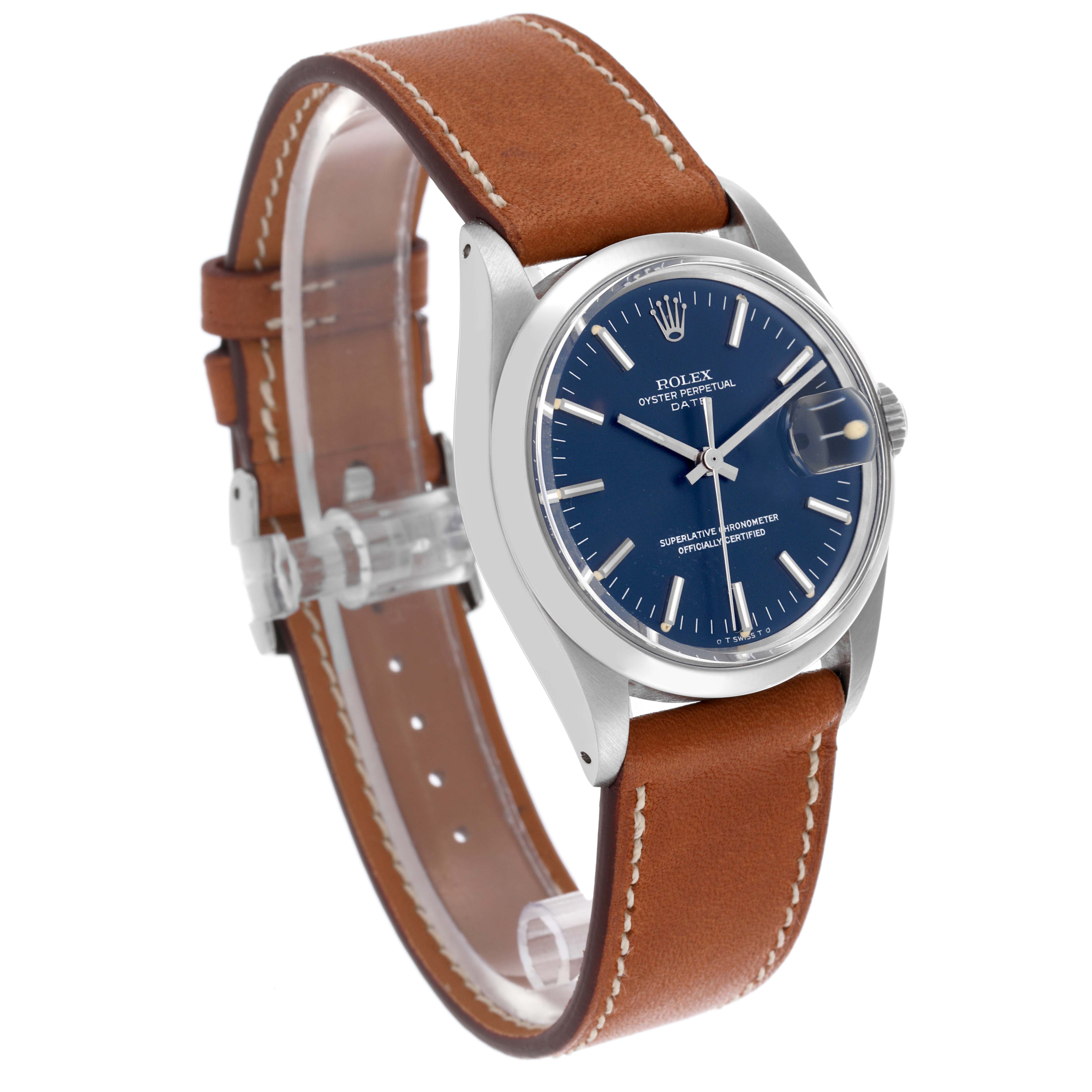 The Rolex Date 1500 Men's Stainless Steel Blue Dial 1500 Men's Stainless Steel Blue Dial watch is shown at a three-quarter angle, highlighting the blue dial, case, brown leather strap, and cyclops lens.