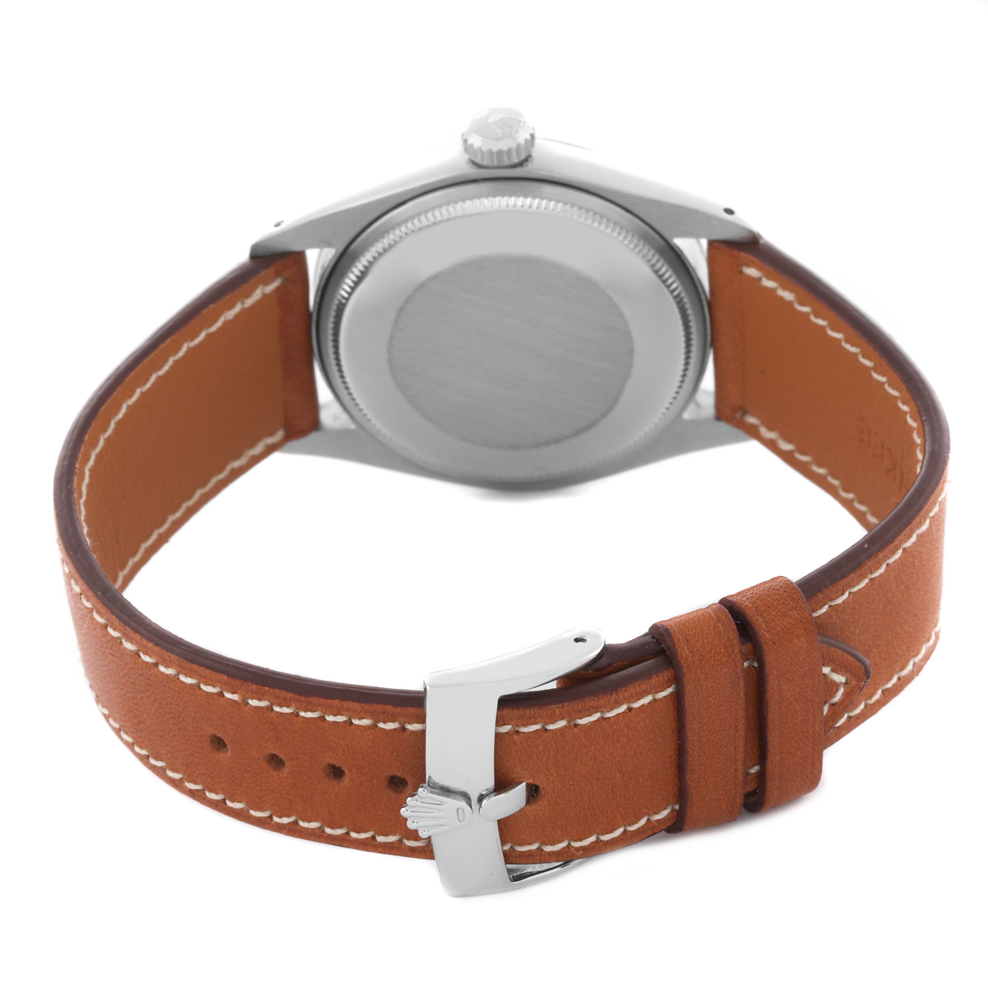 The image shows the back and side of a Rolex Date 1500 Men's Stainless Steel Blue Dial 1500 Men's Stainless Steel Blue Dial watch with a focus on its leather strap and buckle.