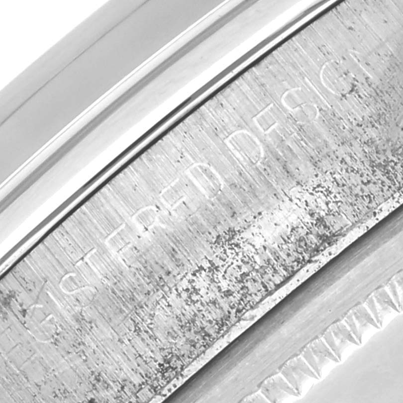 The image shows a close-up of the case engraving on the Rolex Date 1500 Men's Stainless Steel Blue Dial 1500 Men's Stainless Steel Blue Dial model.