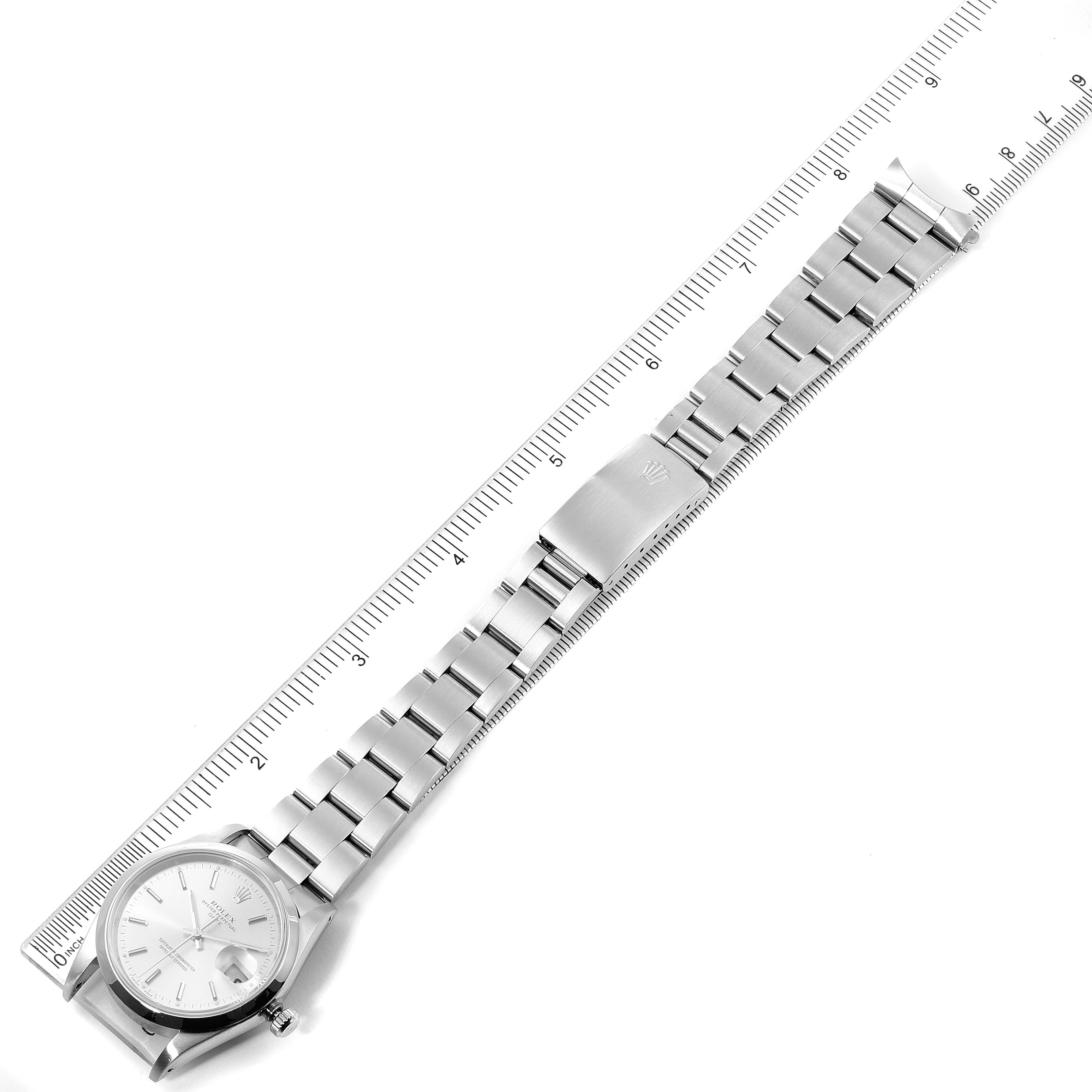 This image shows the Rolex Date 15200 Men's Stainless Steel Silver Dial 15200 Men's Stainless Steel Silver Dial model watch laid flat, displaying its dial, bracelet, and clasp alongside a ruler for size reference.