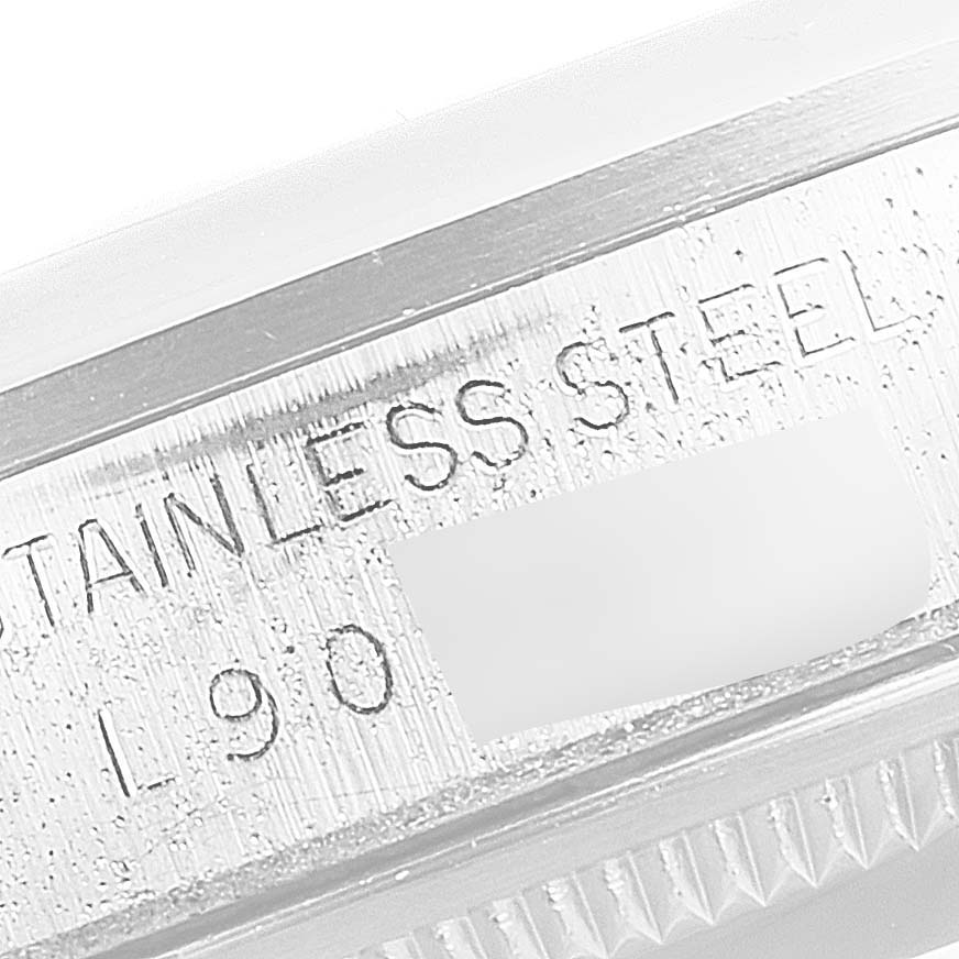 This close-up angle shows the engraved stainless steel part of a Rolex Date 15200 Men's Stainless Steel Silver Dial 15200 Men's Stainless Steel Silver Dial model watch case.