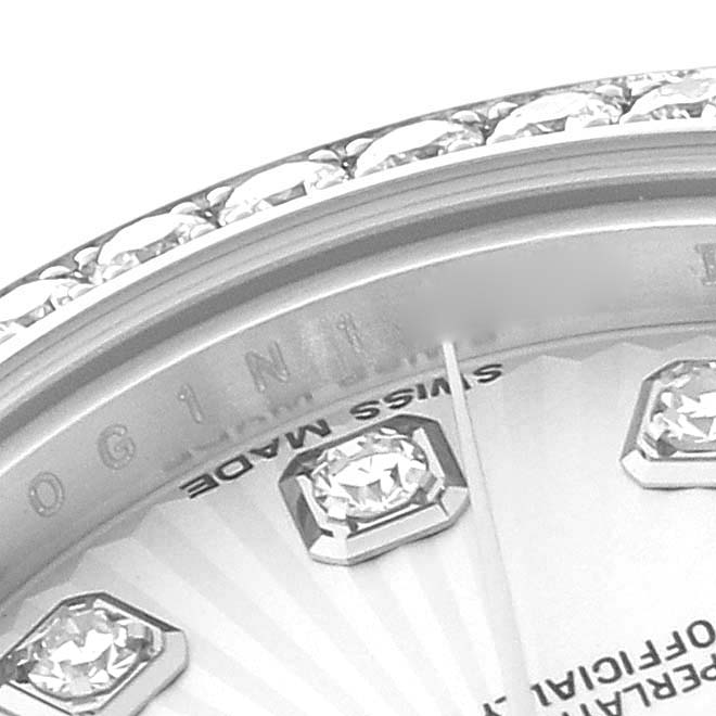 This close-up image of a Rolex Datejust 179384 Women's Stainless Steel Silver Dial 179384 Women's Stainless Steel Silver Dial watch shows the edge of the dial, diamonds, and part of the bezel.
