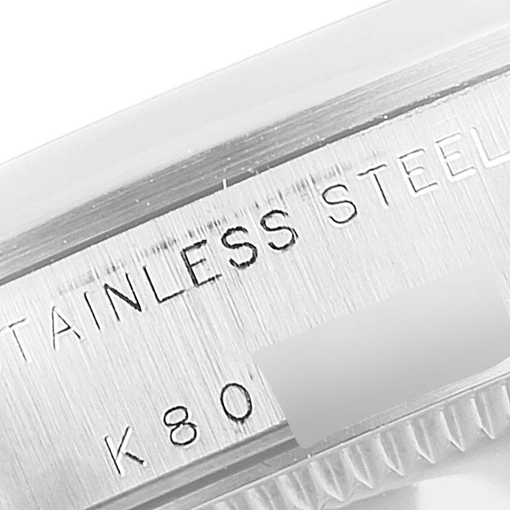 The image shows a close-up of the stainless steel casing of a Rolex Mid-Size 78240 Women's Stainless Steel Pink Dial 78240 Women's Stainless Steel Pink Dial model watch.