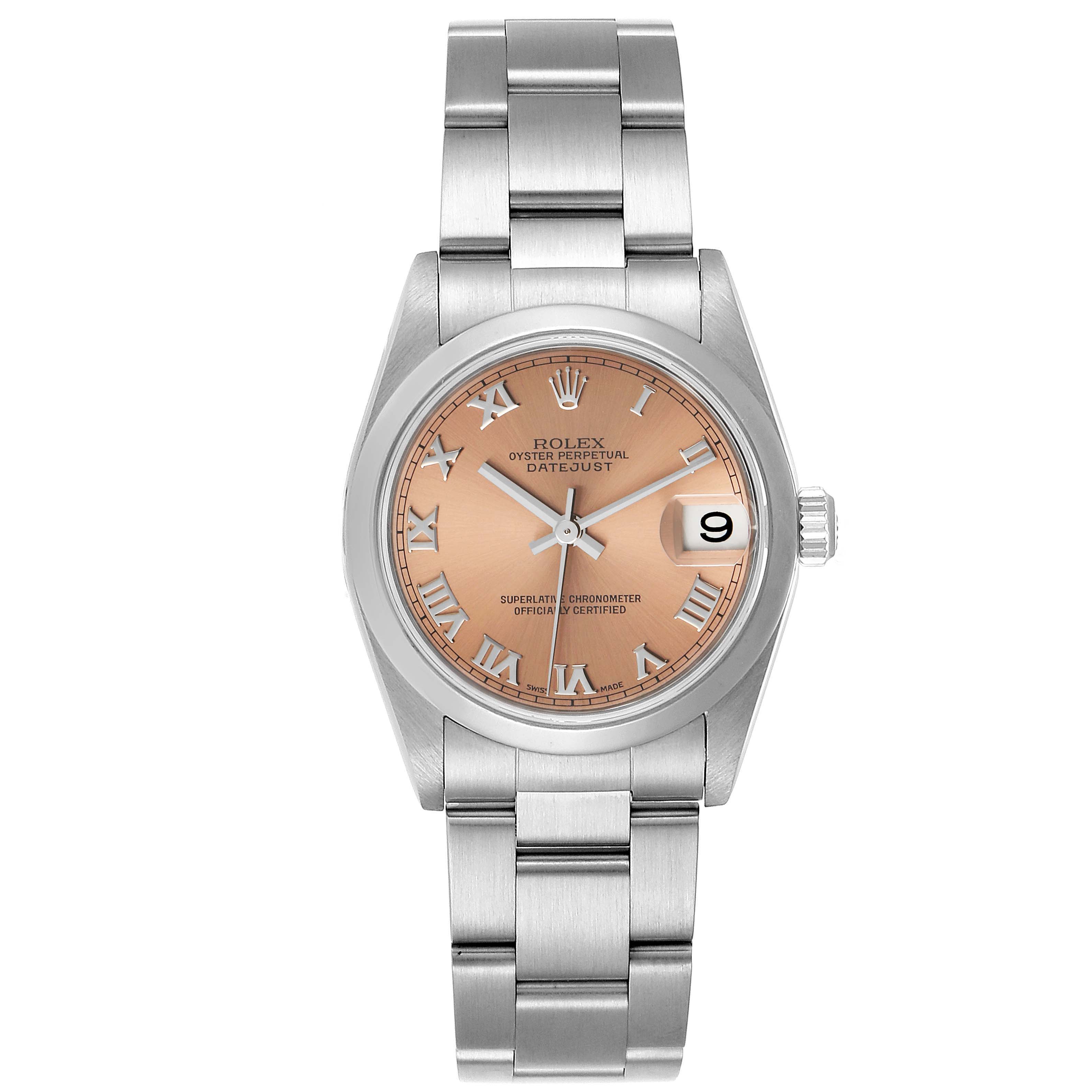 The image shows a front view of a Rolex Oyster Perpetual Datejust Mid-Size watch, featuring a pink dial, Roman numerals, and a metal bracelet.