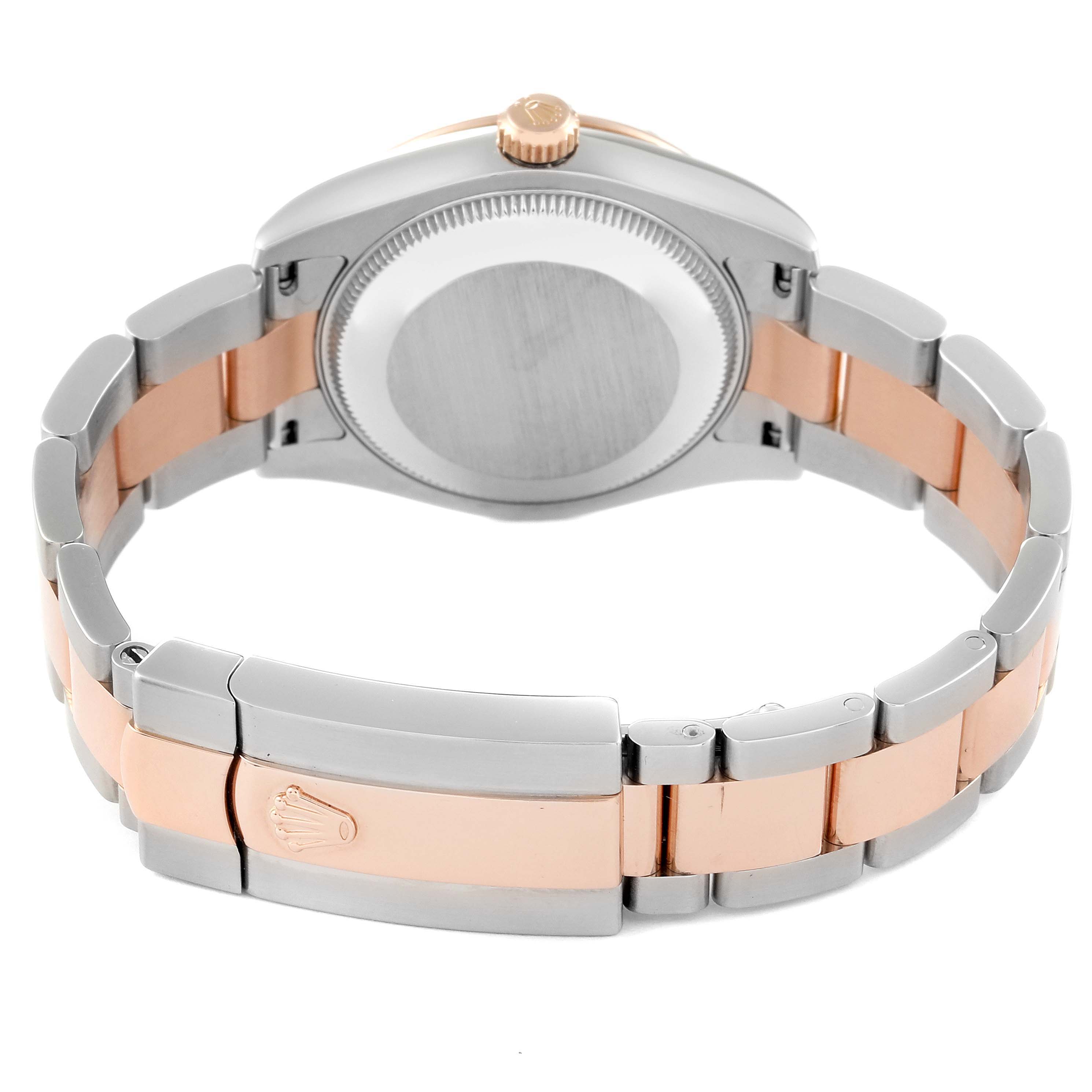 The image shows the back and bracelet of a Rolex Mid-Size 178341 Women
s Steel and Gold (two tone) Mother of Pearl Dial 178341 Women
s Steel and Gold (two tone) Mother of Pearl Dial model, featuring a two-tone design and the clasp with the Rolex crown logo.