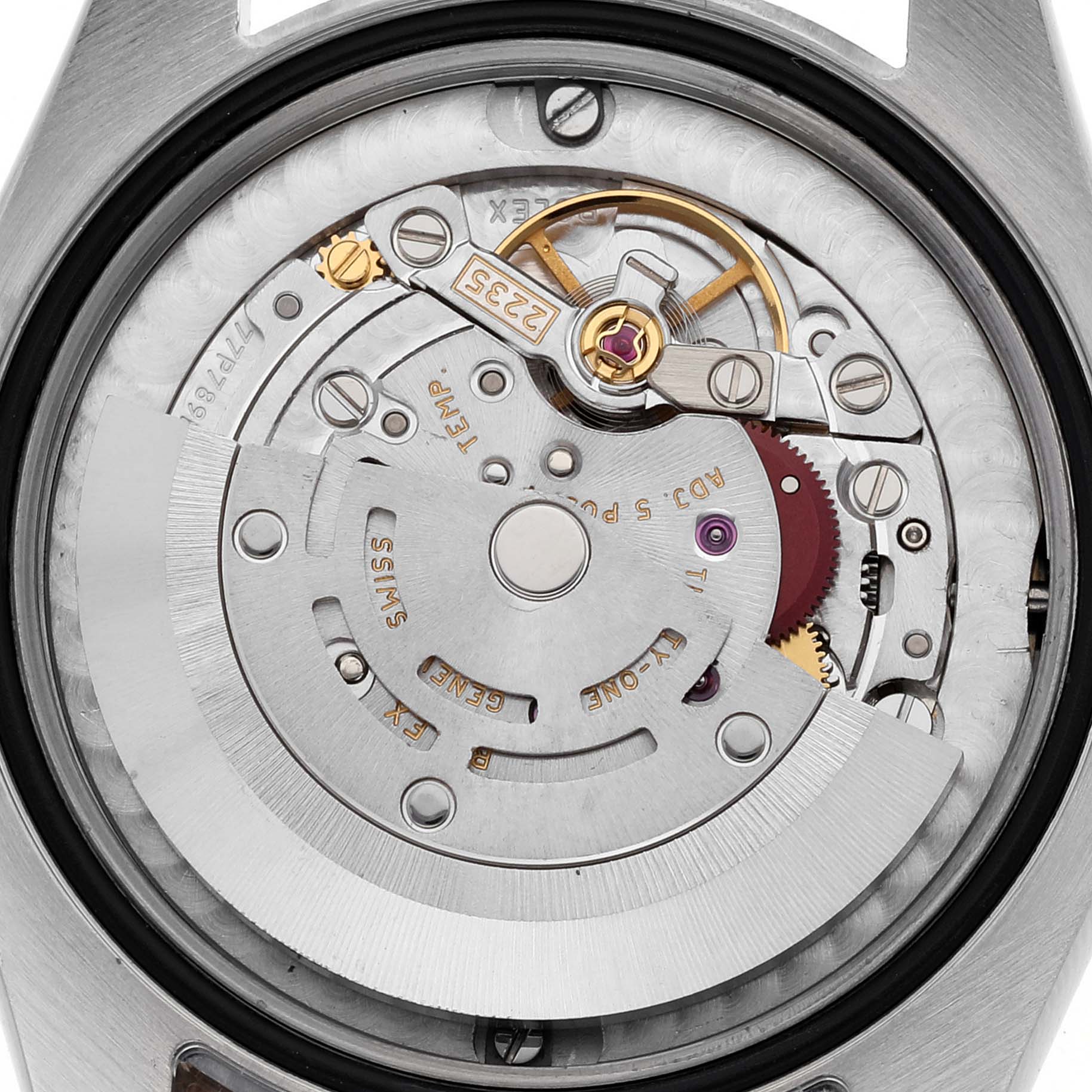 The image shows the internal mechanism of a mid-size Rolex watch, viewed from the back.