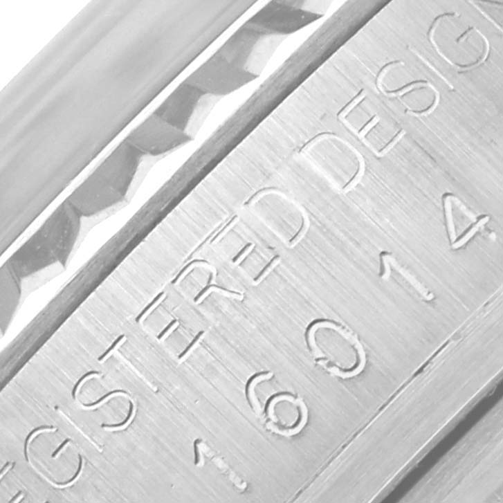 The image shows a close-up side view of the engraved bezel and case edge of a Rolex Datejust 16014 Men's Stainless Steel Silver Dial 16014 Men's Stainless Steel Silver Dial.