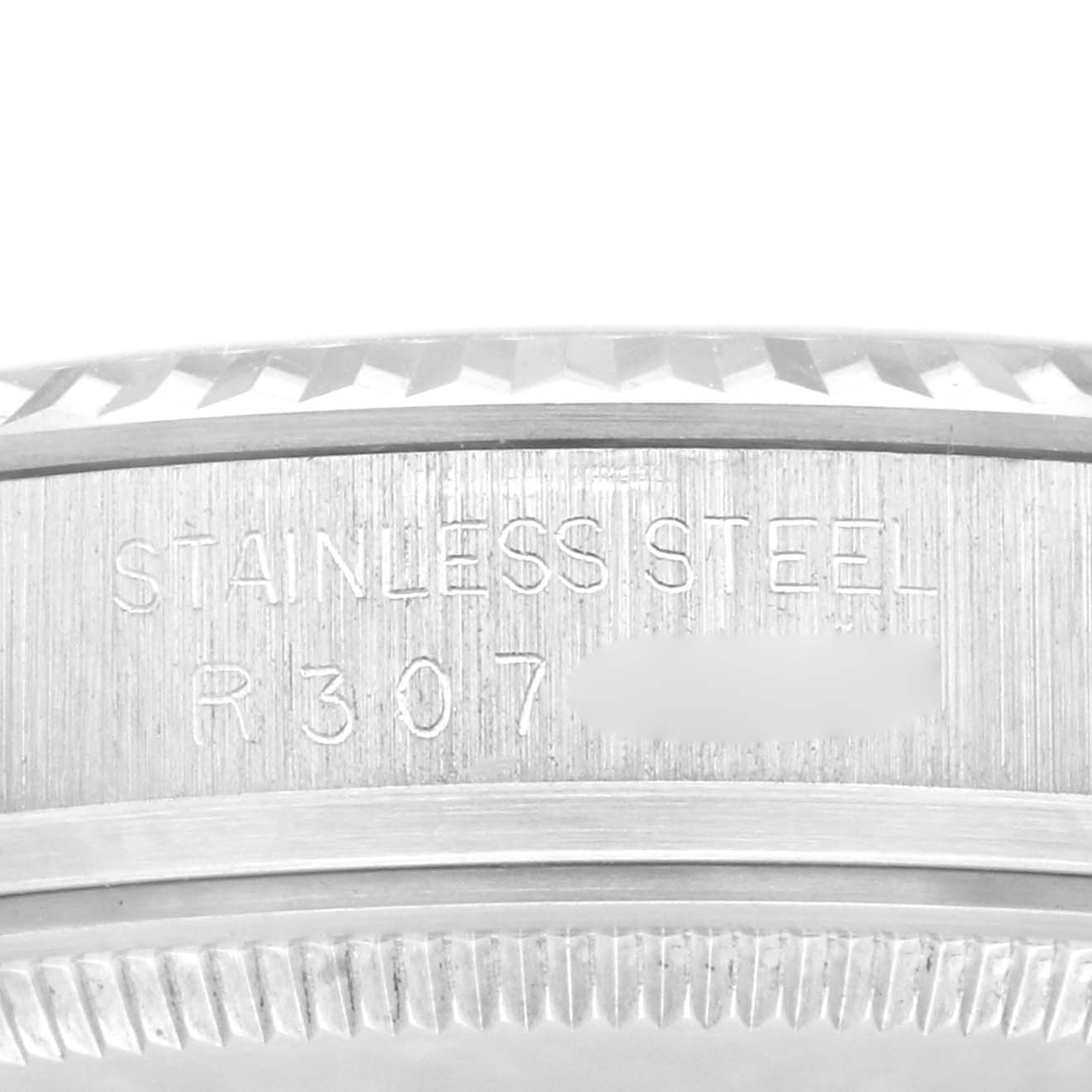 The image shows a close-up of the side of a Rolex Datejust 16014 Men's Stainless Steel Silver Dial 16014 Men's Stainless Steel Silver Dial watch case, displaying the "STAINLESS STEEL" engraving.
