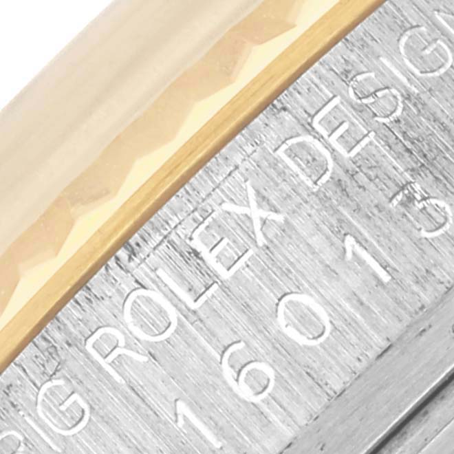 This image shows a close-up view of the Rolex Datejust 16013 Men
s Steel and Gold (two tone) Champagne Dial 16013 Men
s Steel and Gold (two tone) Champagne Dial
s case side, highlighting the engraved model number.