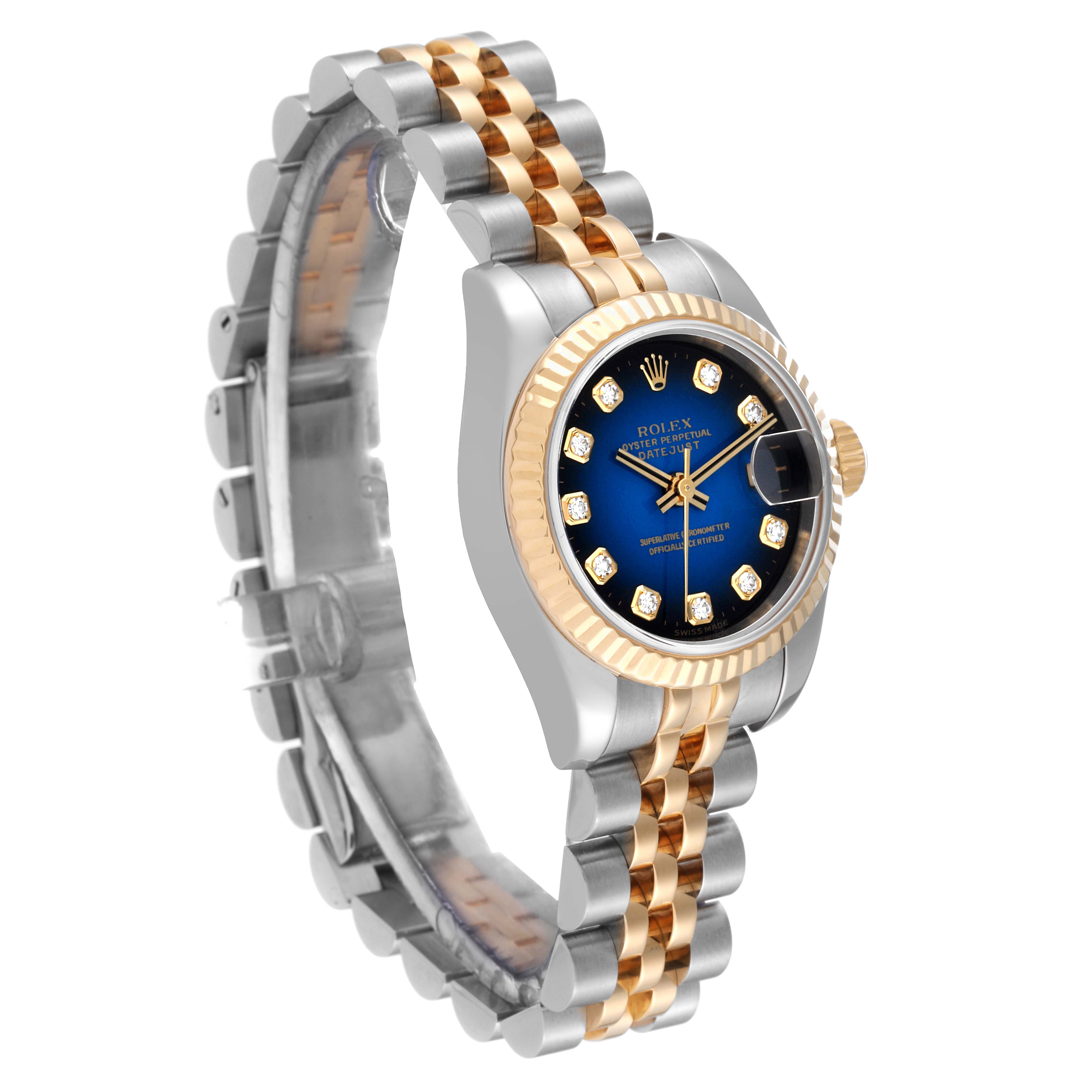 This image showcases a Rolex Datejust 179173 Women's Steel and Gold (two tone) Blue Dial 179173 Women's Steel and Gold (two tone) Blue Dial watch angled slightly to the right, highlighting its face, bezel, and part of the bracelet.