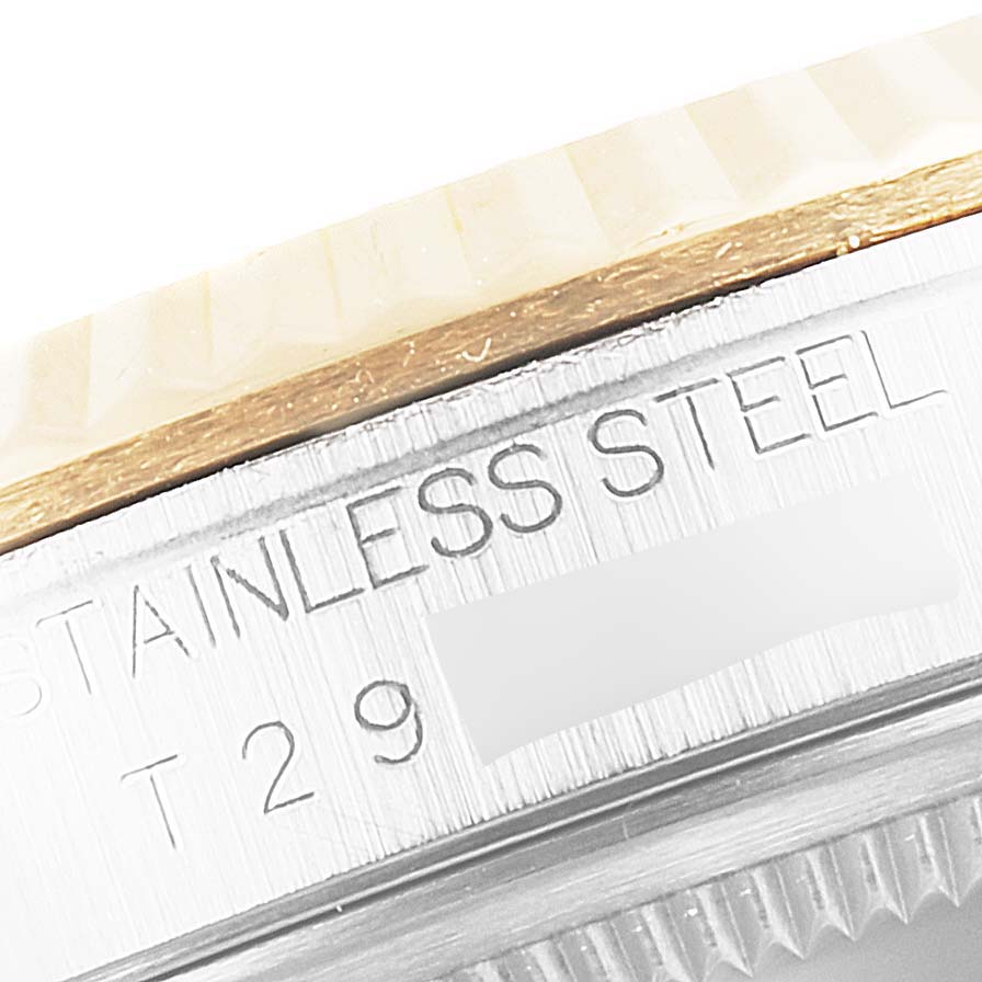 The image shows a close-up of the stainless steel bezel and part of the engraving on the Rolex Datejust 16233 Men
s Steel and Gold (two tone) Grey Dial 16233 Men
s Steel and Gold (two tone) Grey Dial watch.