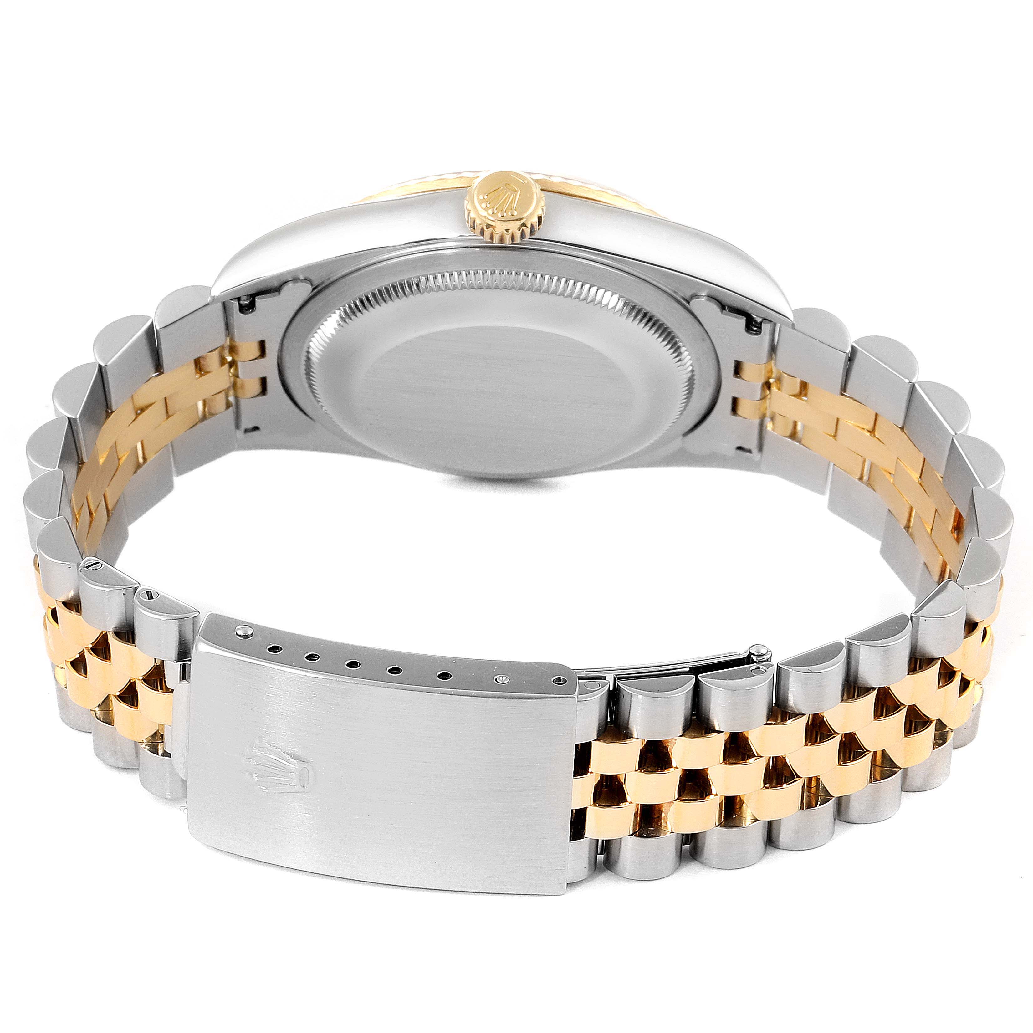 This image shows the back case and bracelet clasp of a Rolex Datejust 16233 Men
s Steel and Gold (two tone) Grey Dial 16233 Men
s Steel and Gold (two tone) Grey Dial watch, featuring a two-tone metal band.