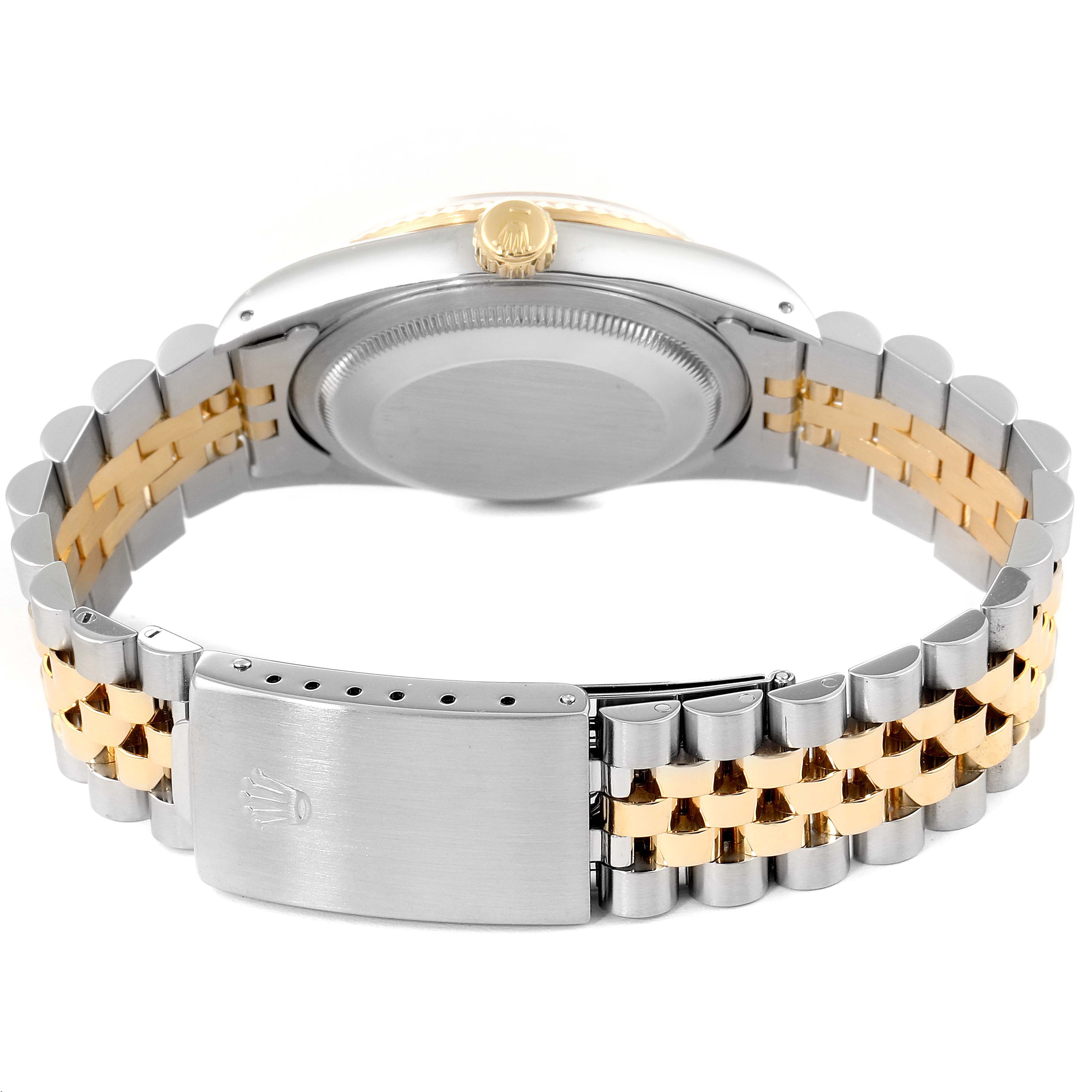 The image shows the back view of the Rolex Datejust 16233 Men's Steel and Gold (two tone) White Dial 16233 Men's Steel and Gold (two tone) White Dial watch, highlighting its clasp and two-tone bracelet.