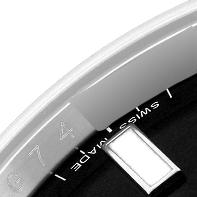 The image shows a close-up of a Rolex Explorer 216570 Men's Stainless Steel Black Dial 216570 Men's Stainless Steel Black Dial watch dial focusing on the "Swiss Made" text and part of the outer edge.