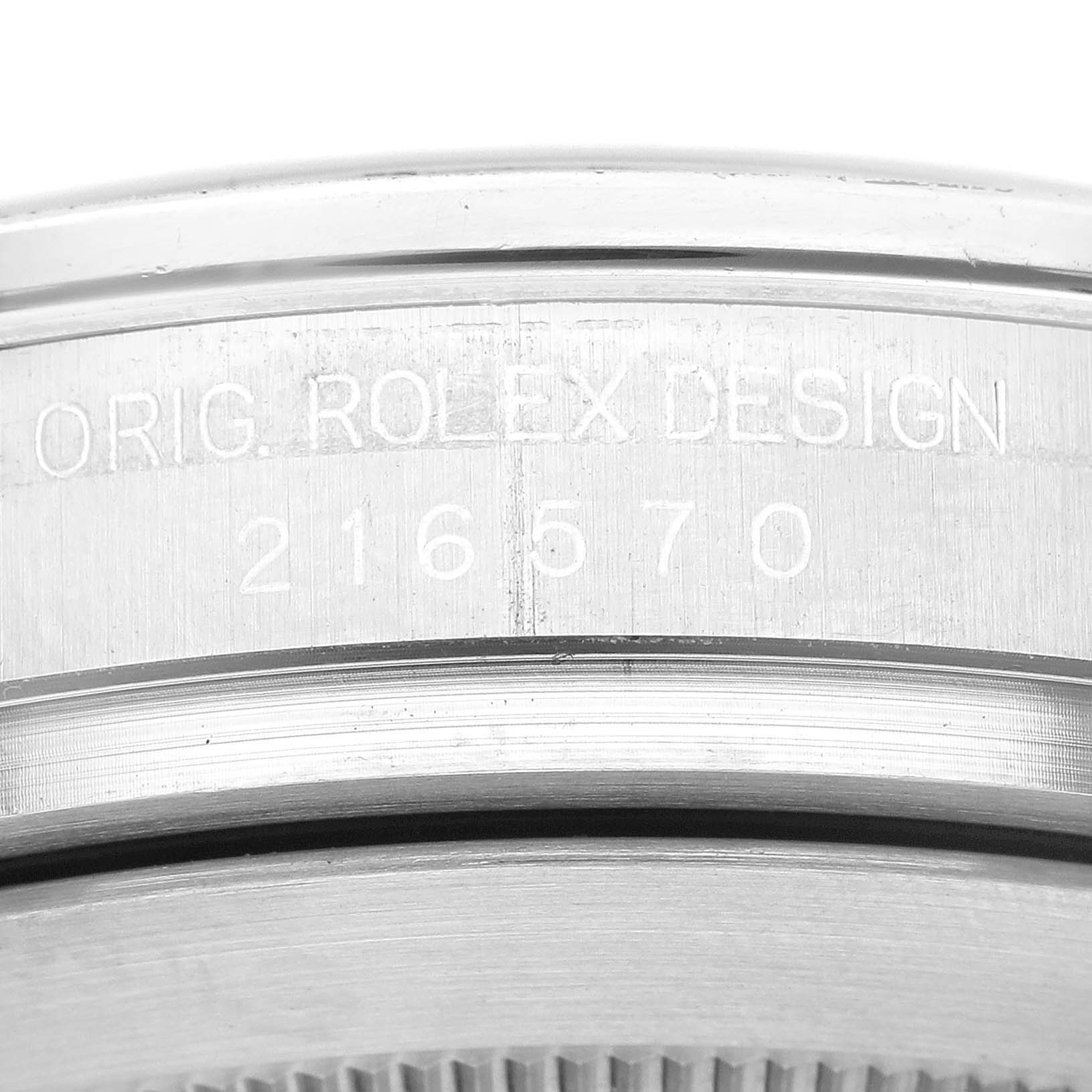 This image shows a close-up of the side view of a Rolex Explorer 216570 Men's Stainless Steel White Dial 216570 Men's Stainless Steel White Dial model, highlighting the engraved "ORIG. ROLEX DESIGN" and model number.