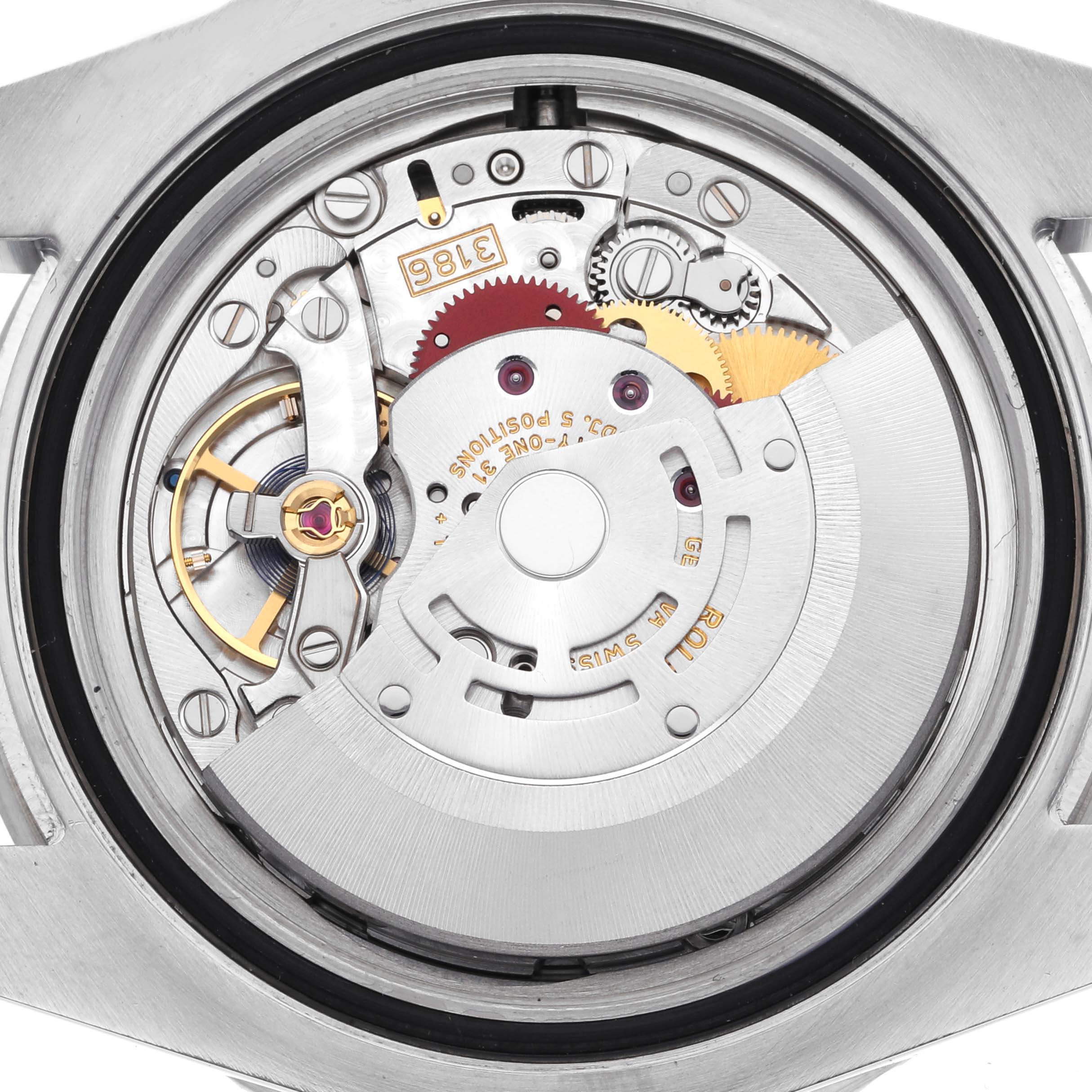 The image shows the movement of a Rolex GMT-Master 116710LN Men
s Stainless Steel Black Dial 116710LN Men
s Stainless Steel Black Dial watch from a top-down angle, highlighting gears and the rotor.