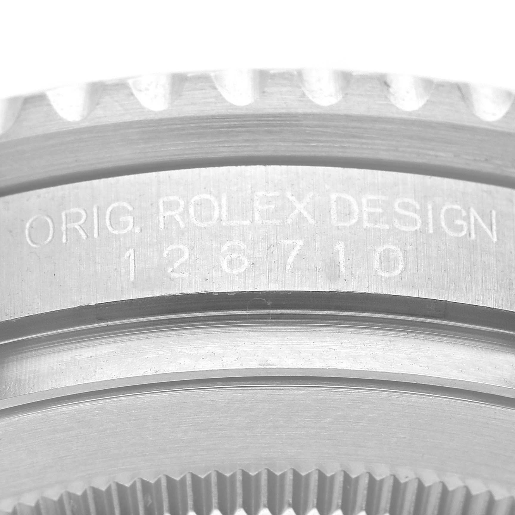This image displays a close-up of the serial number engraving on the side case of a Rolex GMT-Master 126710BLRO Men
s Stainless Steel Black Dial 126710BLRO Men
s Stainless Steel Black Dial watch.