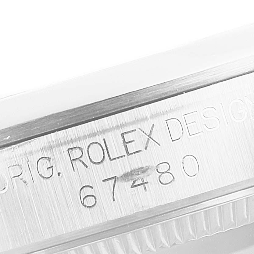 This close-up image displays the model number "67480" engraved on the side of a Mid-Size Rolex watch case.
