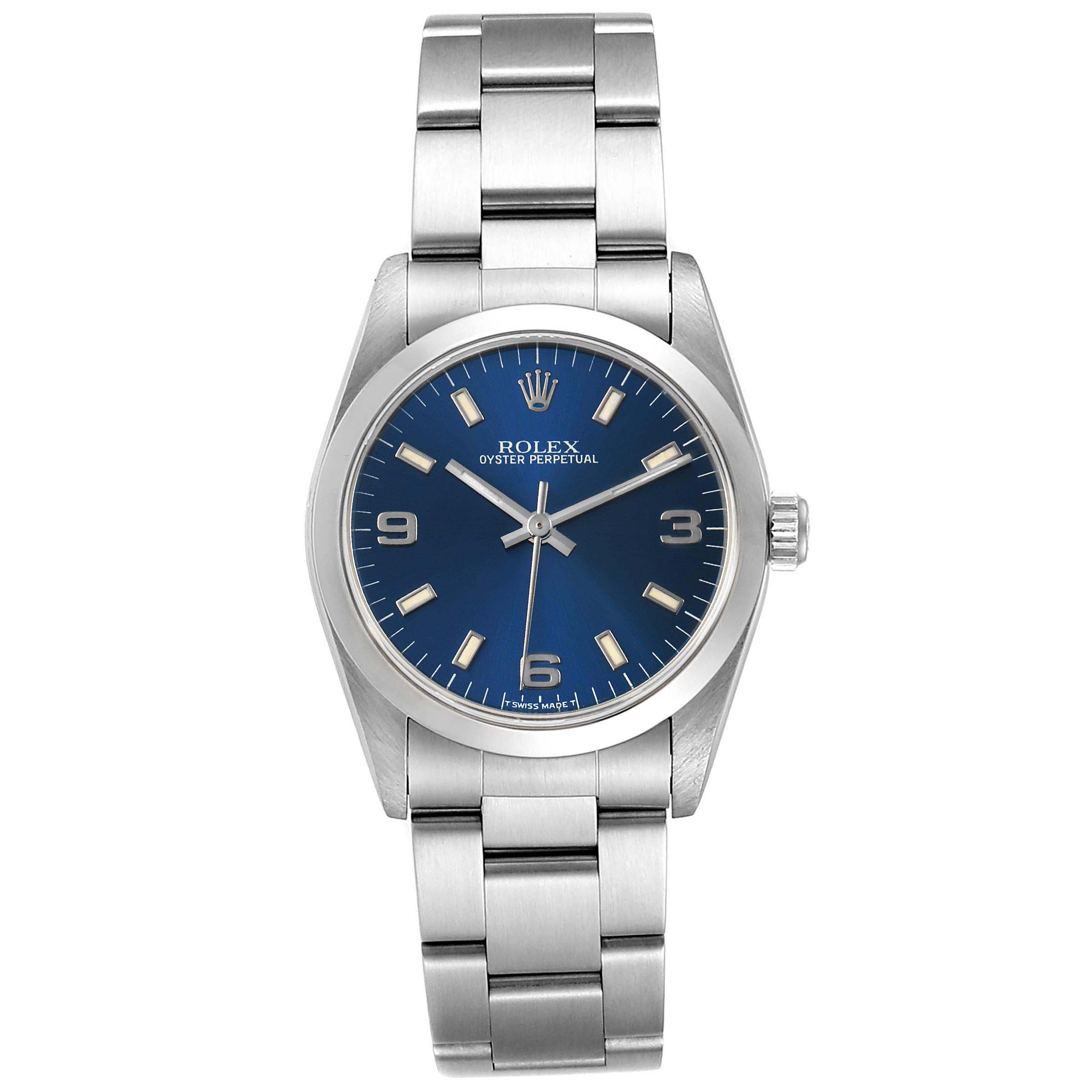 The image shows a front view of a Rolex Oyster Perpetual Mid-Size watch with a blue dial and stainless steel bracelet.