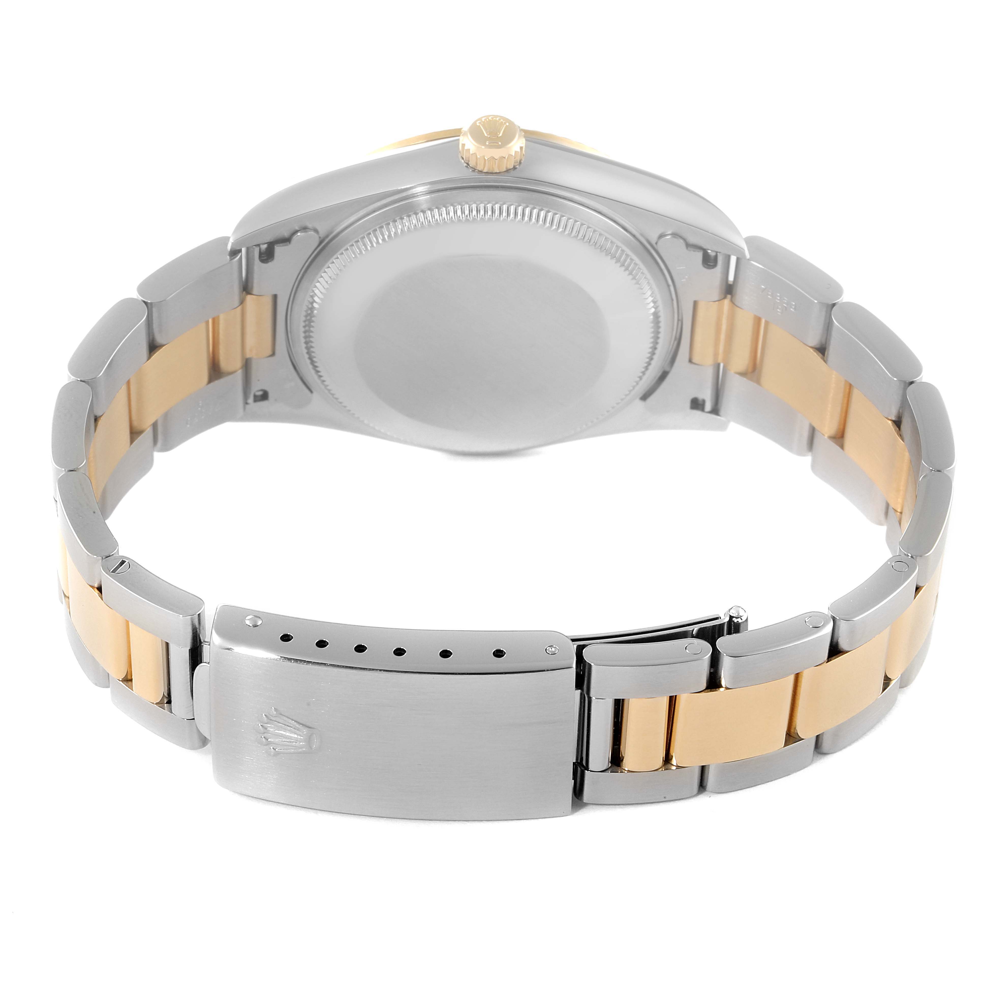 This image shows the back view of a Rolex Oyster Perpetual 14233 Men
s Steel and Gold (two tone) Champagne Dial 14233 Men
s Steel and Gold (two tone) Champagne Dial watch, highlighting the case back and the two-tone bracelet.