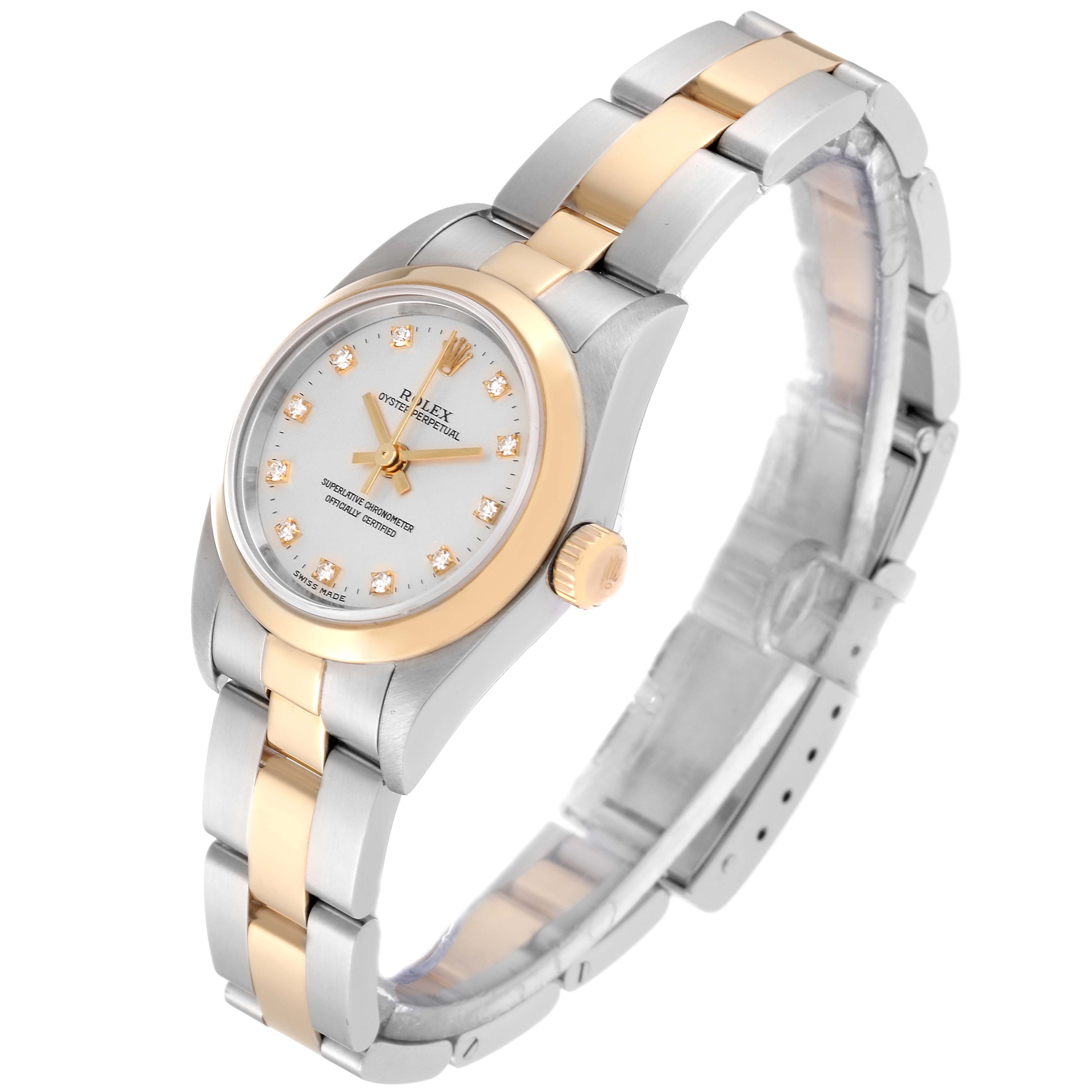 The Rolex Oyster Perpetual K745869 Women's Steel and Gold (two tone) Silver Dial K745869 Women's Steel and Gold (two tone) Silver Dial watch is shown at an angle displaying the dial, crown, and two-tone bracelet.