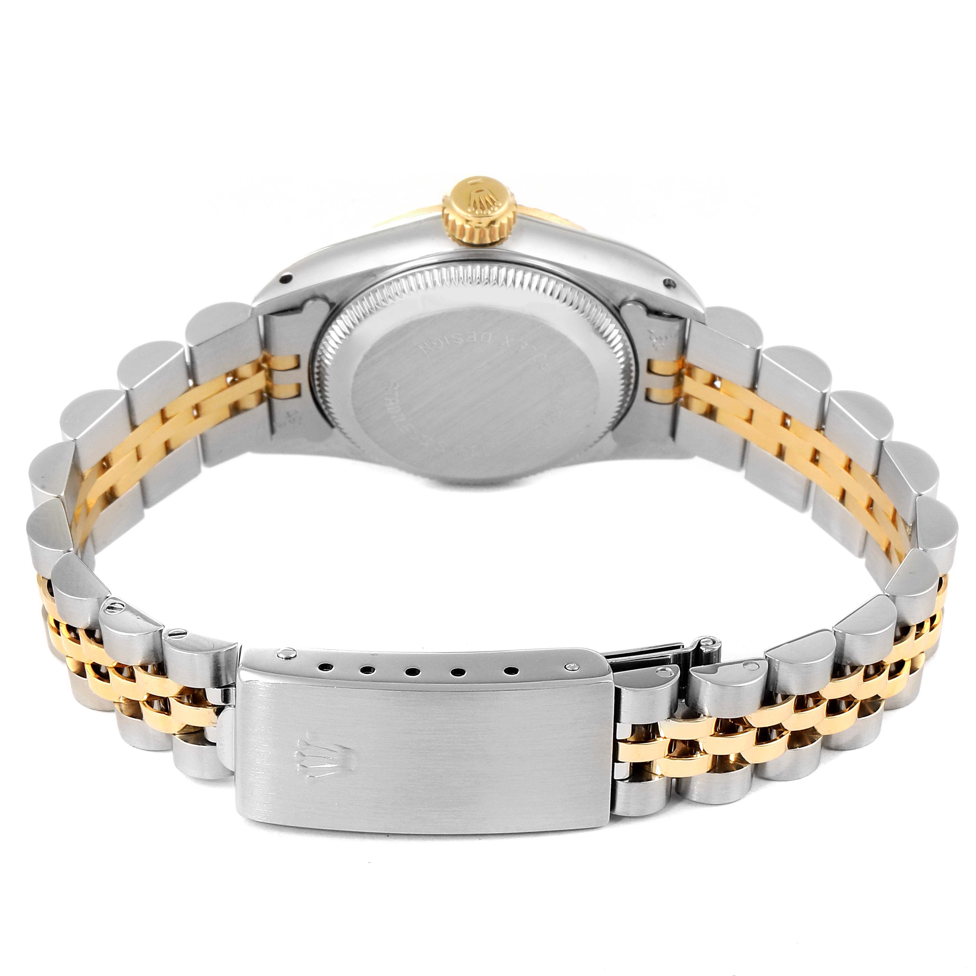 The image shows the back view of the Rolex Oyster Perpetual 67193 Women
s Steel and Gold (two tone) White Dial 67193 Women
s Steel and Gold (two tone) White Dial watch, highlighting the case back, crown, and bi-metal bracelet.